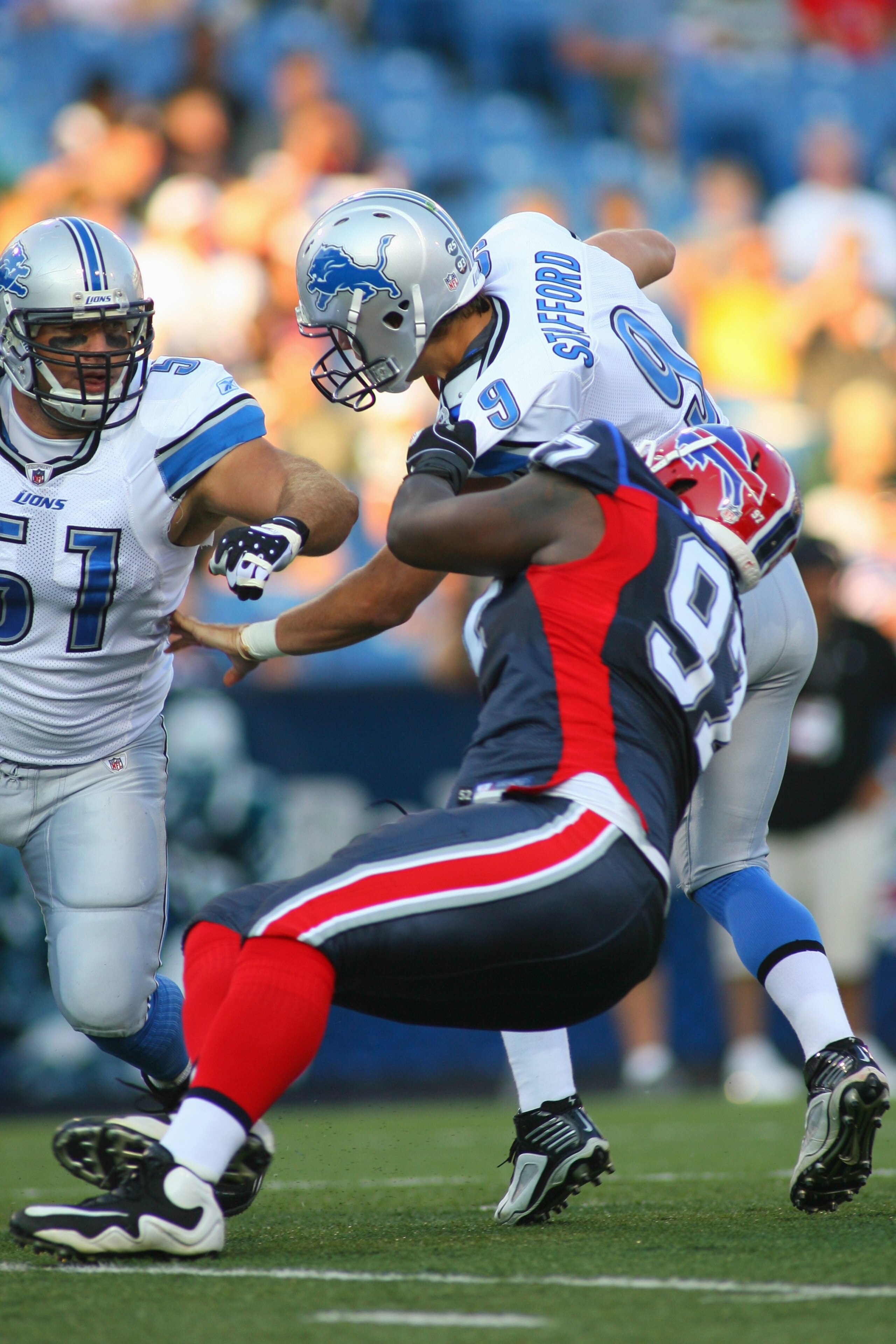 ORCHARD PARK, NY - SEPTEMBER 3:  John McCargo #97 of the Buffalo Bills sacks Matthew Stafford #9 of the Detroit Lions during the preseason game at Ralph Wilson Stadium on September 3, 2009 in Orchard Park, New York. (Photo by Rick Stewart/Getty Images)