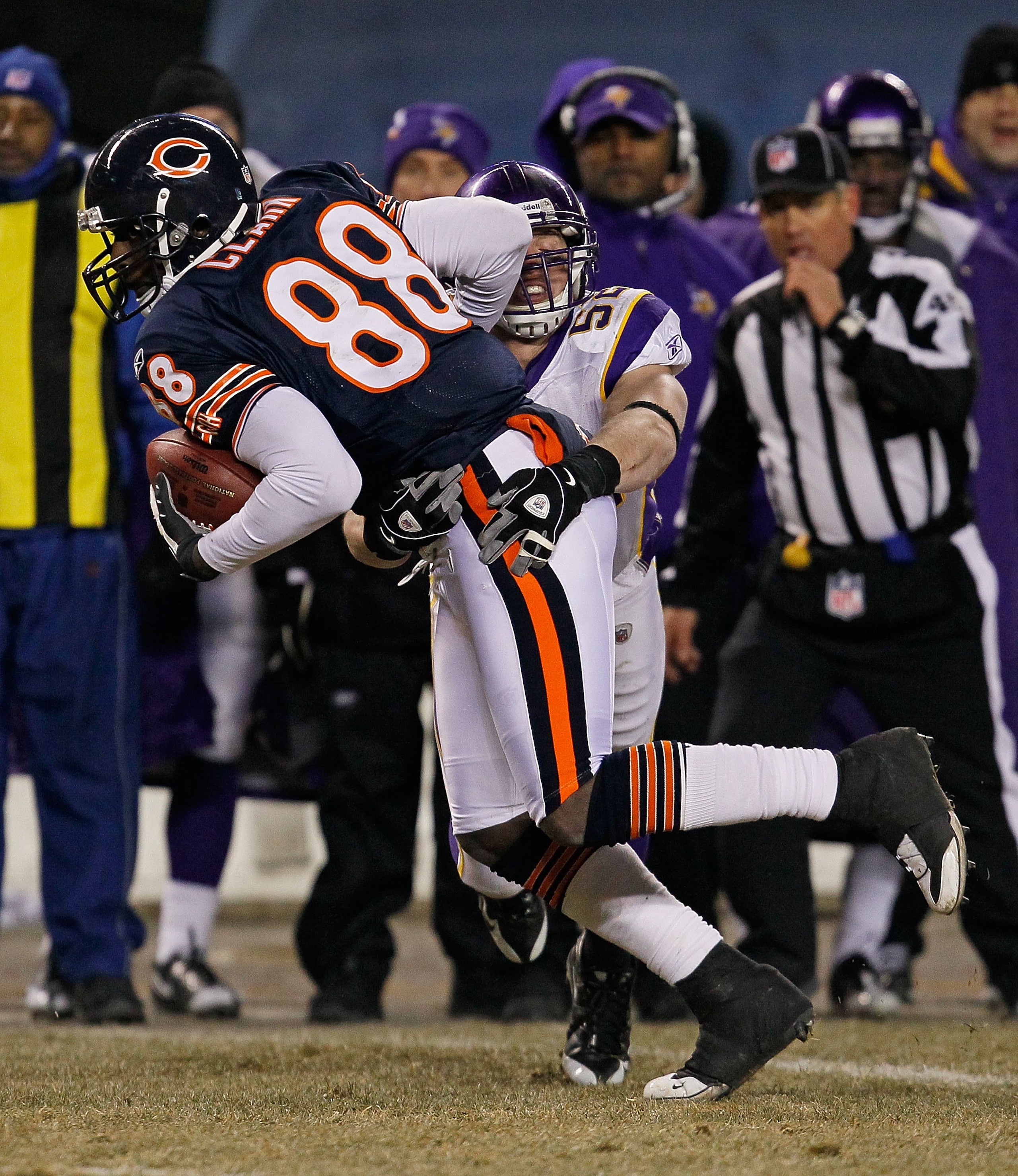 CHICAGO - DECEMBER 28: Desmond Clark #88 of the Chicago Bears tries to break away from Chad Greenway #52 of the Minnesota Vikings at Soldier Field on December 28, 2009 in Chicago, Illinois. The Bears defeated the Vikings 36-30 in overtime. (Photo by Jonat