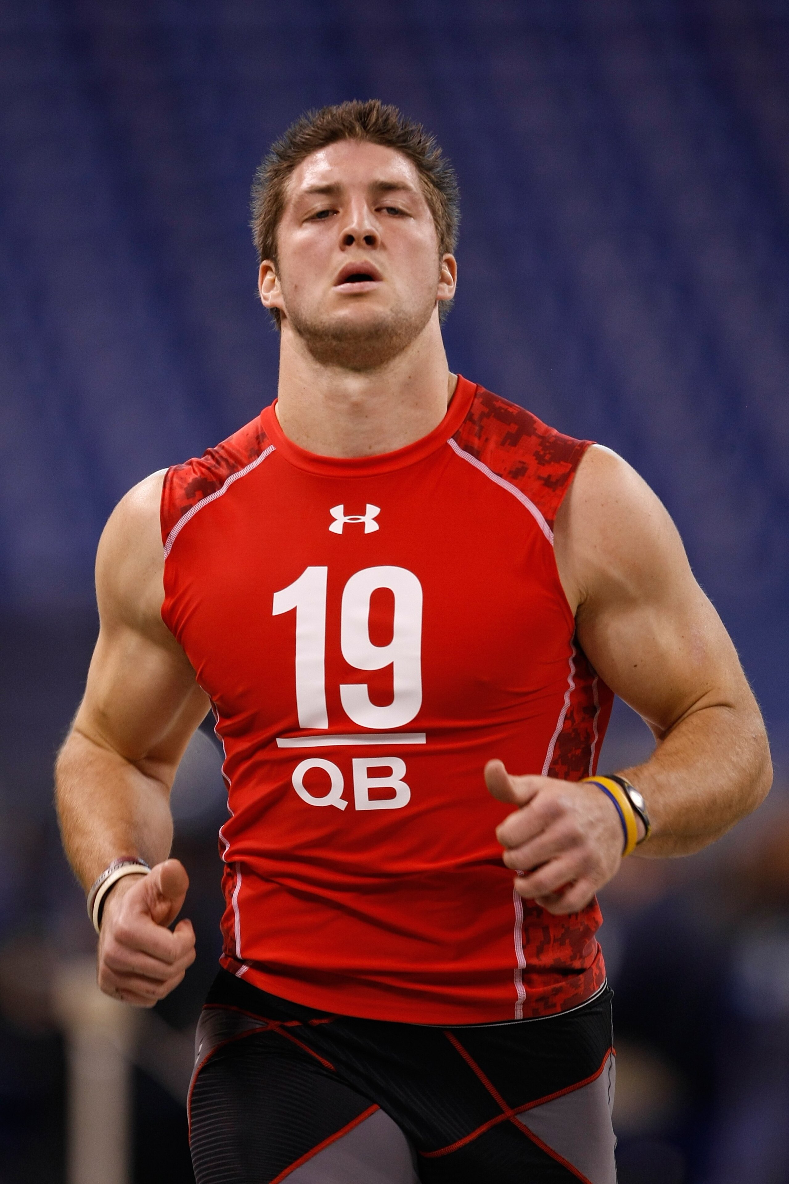 INDIANAPOLIS, IN - FEBRUARY 28: Quarterback Tim Tebow of Florida runs the 40 yard dash during the NFL Scouting Combine presented by Under Armour at Lucas Oil Stadium on February 28, 2010 in Indianapolis, Indiana. (Photo by Scott Boehm/Getty Images)