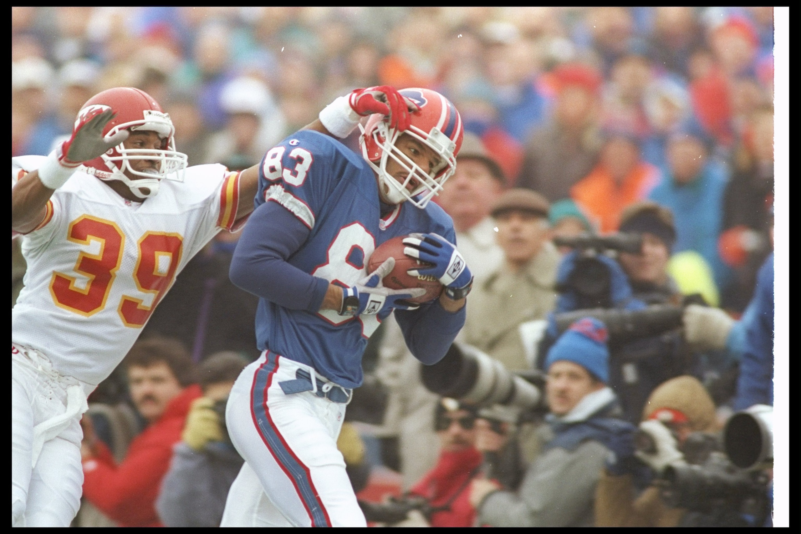 23 Jan 1994:  Wide receiver Andre Reed of the Buffalo Bills catches the ball as Kansas City Chiefs defensive back Bruce Pickens covers him during a playoff game at Rich Stadium in Orchard Park, New York.  The Bills won the game, 30-13. Mandatory Credit: R