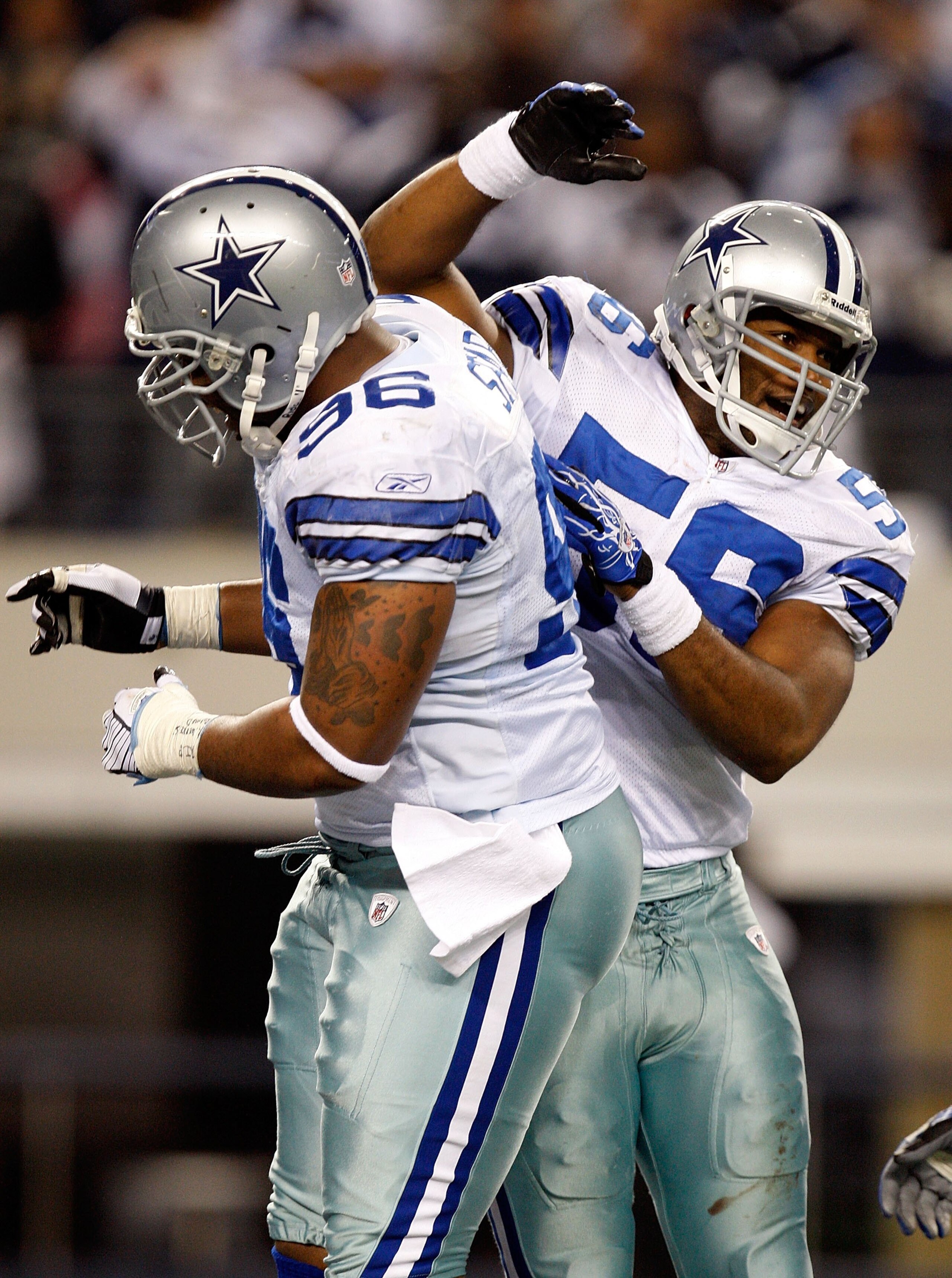 ARLINGTON, TX - JANUARY 9:  Linebacker Bradie James #56 and Marcus Spears #96 of the Dallas Cowboys during the 2010 NFC wild-card playoff game at Cowboys Stadium on January 9, 2010 in Arlington, Texas. (Photo by Ronald Martinez/Getty Images)