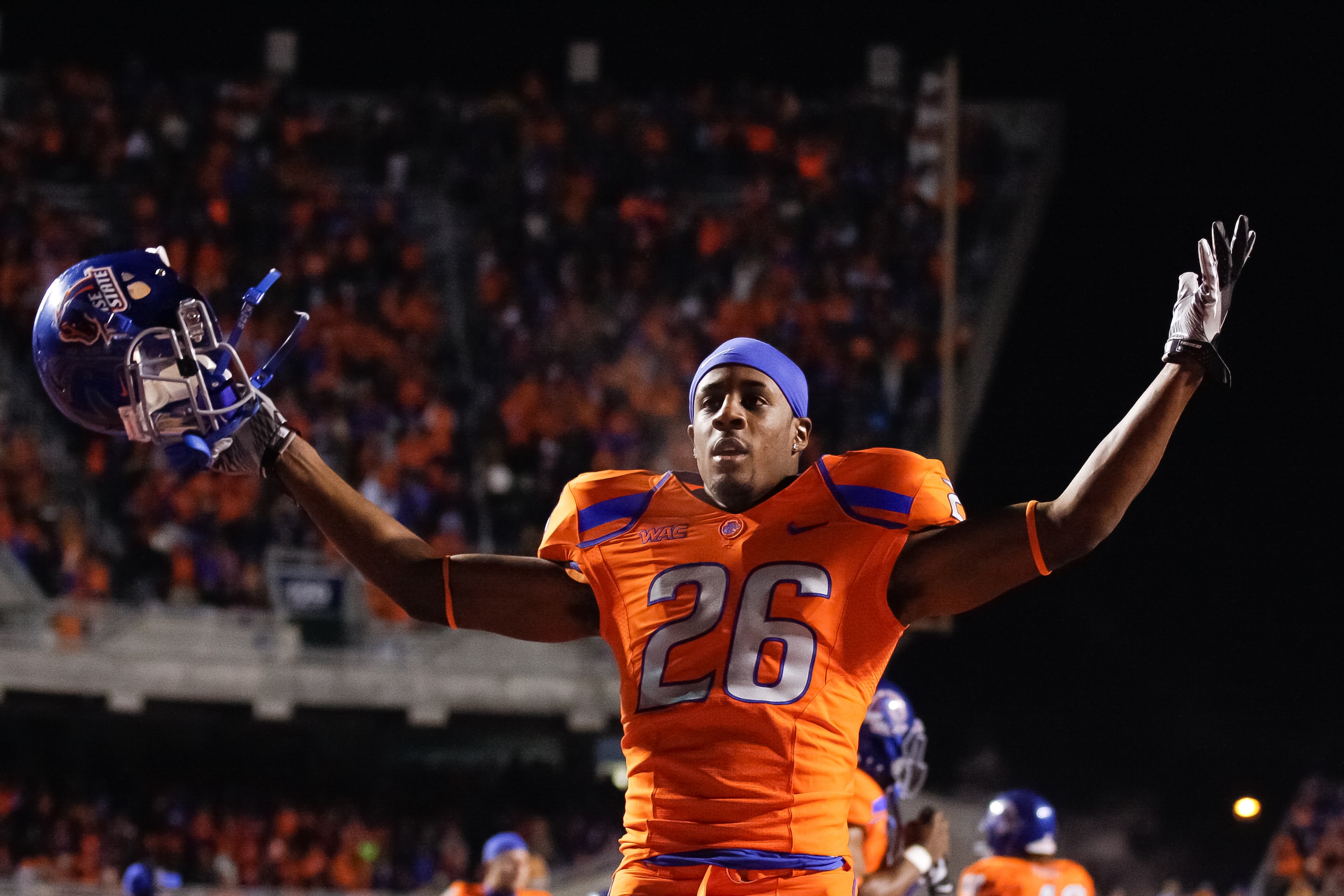 BOISE, ID - NOVEMBER 19:  Quaylon Ewing-Burton #26 of the Boise State Broncos psyches up the crowd before the game against the Fresno State Bulldogs at Bronco Stadium on November 19, 2010 in Boise, Idaho.  (Photo by Otto Kitsinger III/Getty Images)