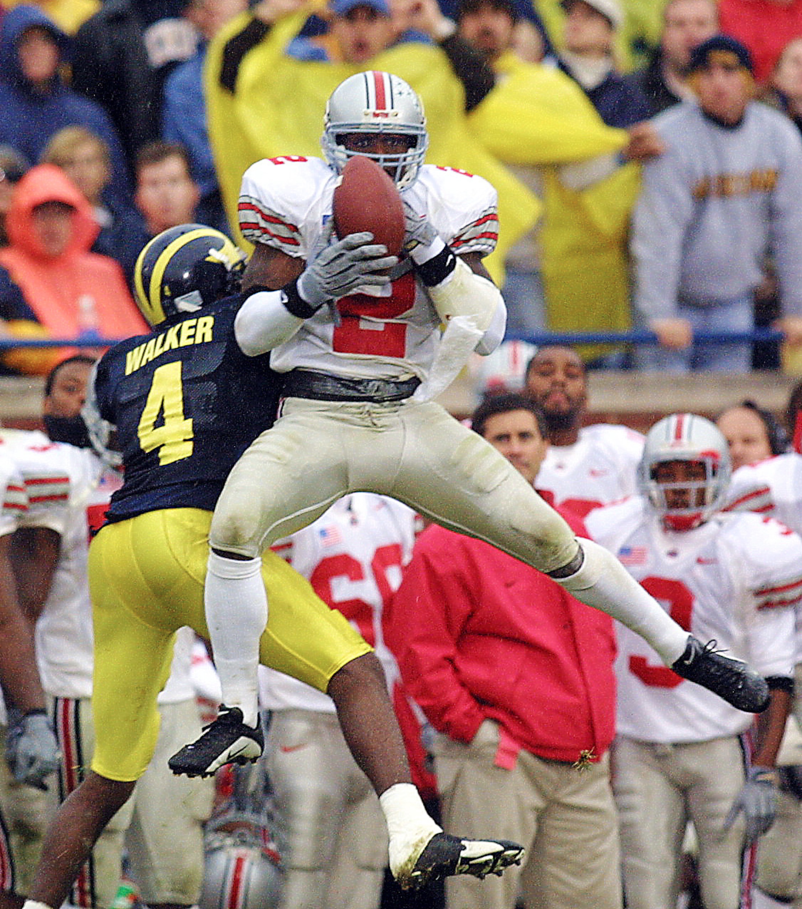 24 Nov 2001: Mike Doss #2 of Ohio State intercepts the ball over Wide Receiver Marquise Walker #4 of Michigan in the second half at  Michigan Stadium in Ann Arbor, Michigan. The Buckeyes beat the Wolverines 26-20. DIGITAL IMAGE Mandatory Credit: Danny Mol