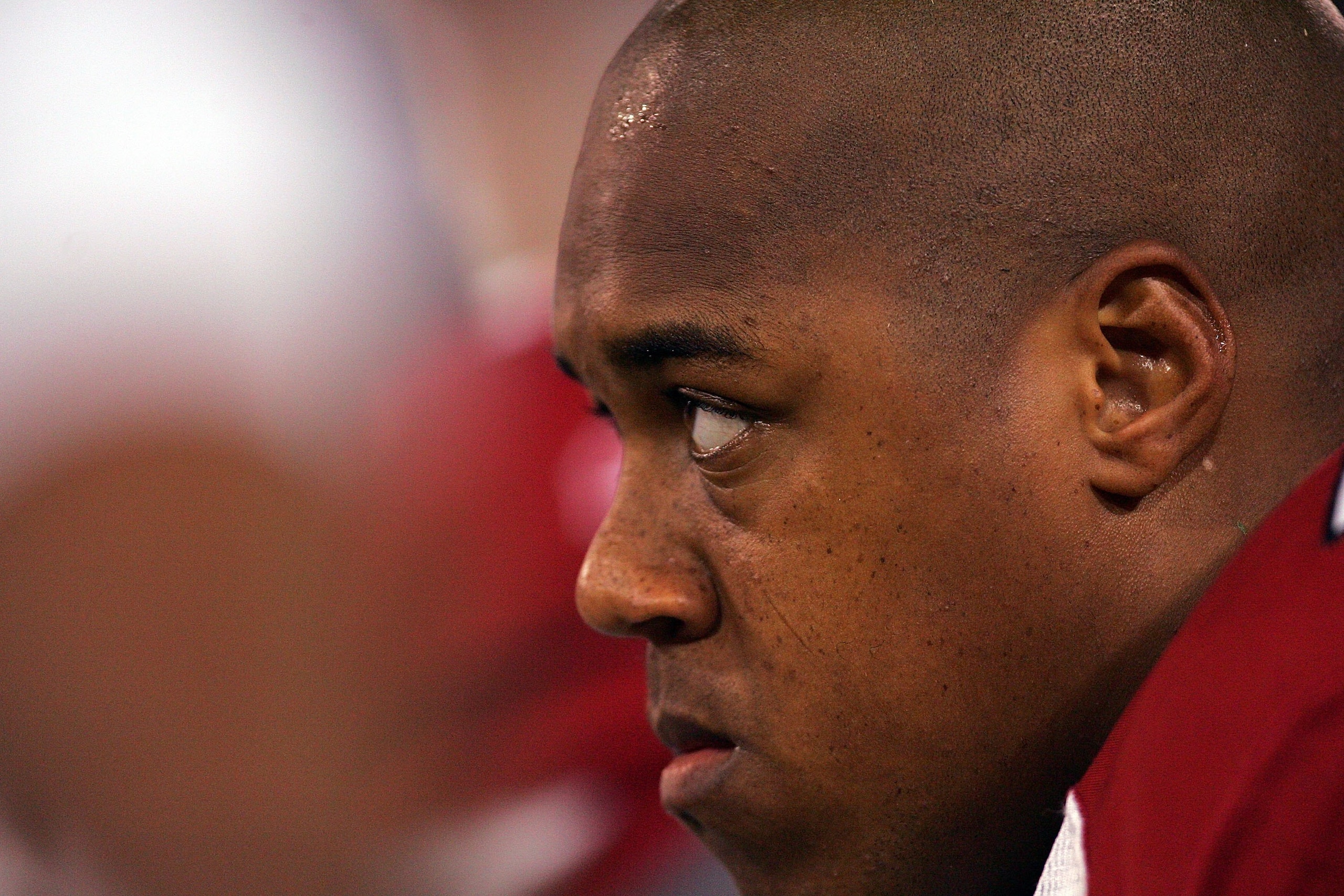 SAN FRANCISCO - DECEMBER 14:  Reggie Wells #74 of the Arizona Cardinals sits on the sideline prior to the game against the San Francisco 49ers at Candlestick Park on December 14, 2009 in San Francisco, California.  (Photo by Ezra Shaw/Getty Images)