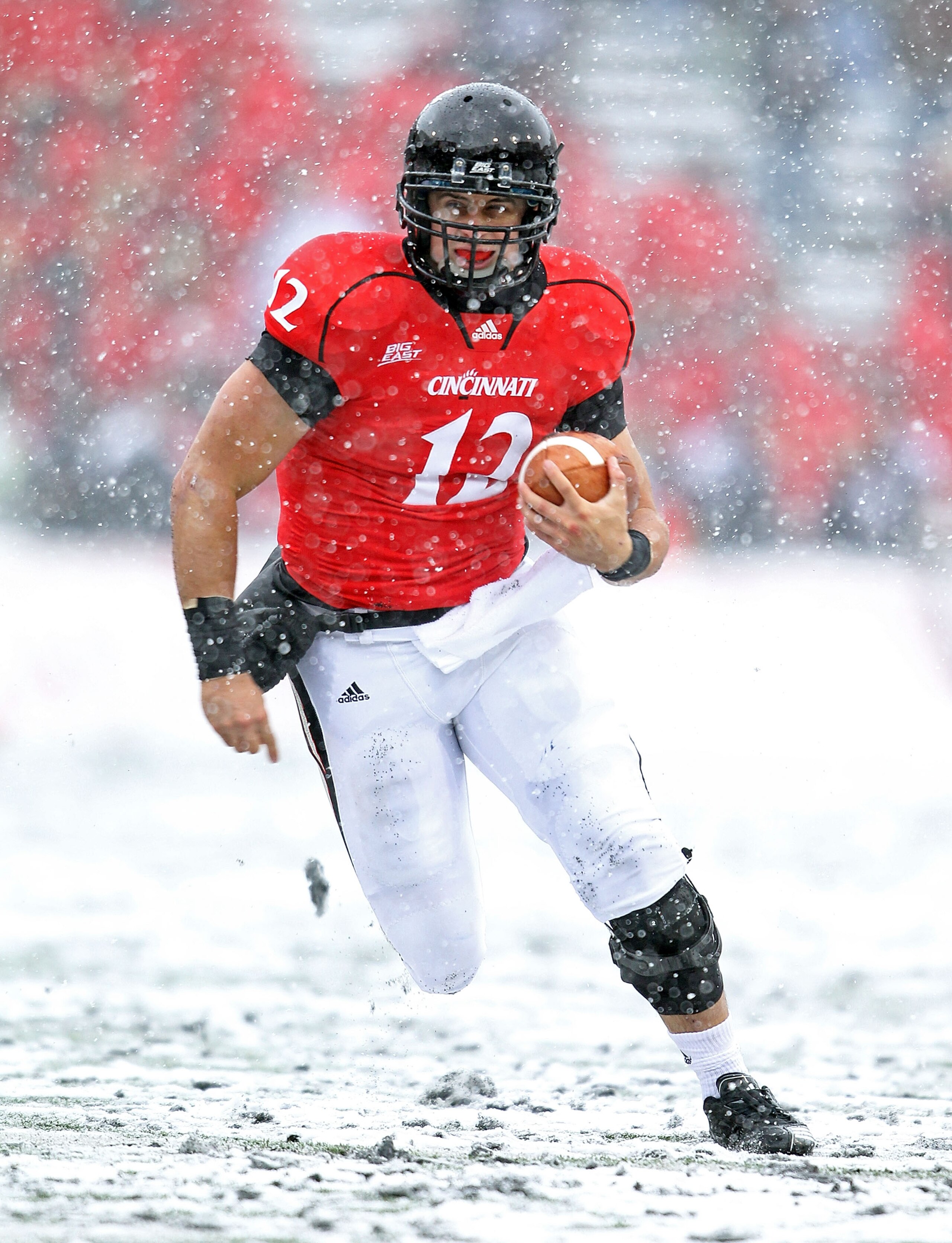 CINCINNATI, OH - DECEMBER 04:  Zach Collaros #12 of the Cincinnati Bearcats runs with the ball  during the Big East Conference game against the Pittsburgh Panthers at Nippert Stadium on December 4, 2010 in Cincinnati, Ohio. Pittsburgh won 28-10.  (Photo b