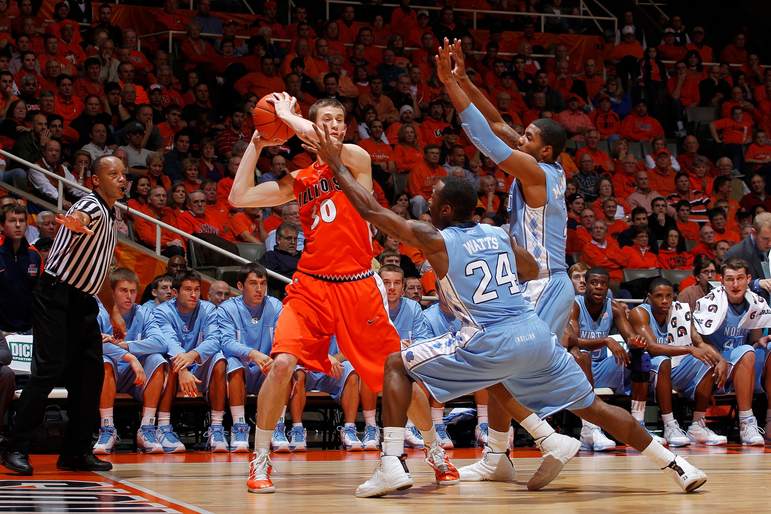 CHAMPAIGN, IL - NOVEMBER 30: Justin Watts #24 and Leslie McDonald #2 of the North Carolina Tar Heels defend against Bill Cole #30 of the Illinois Fighting Illini during the 2010 ACC/Big Ten Challenge at Assembly Hall on November 30, 2010 in Champaign, Ill