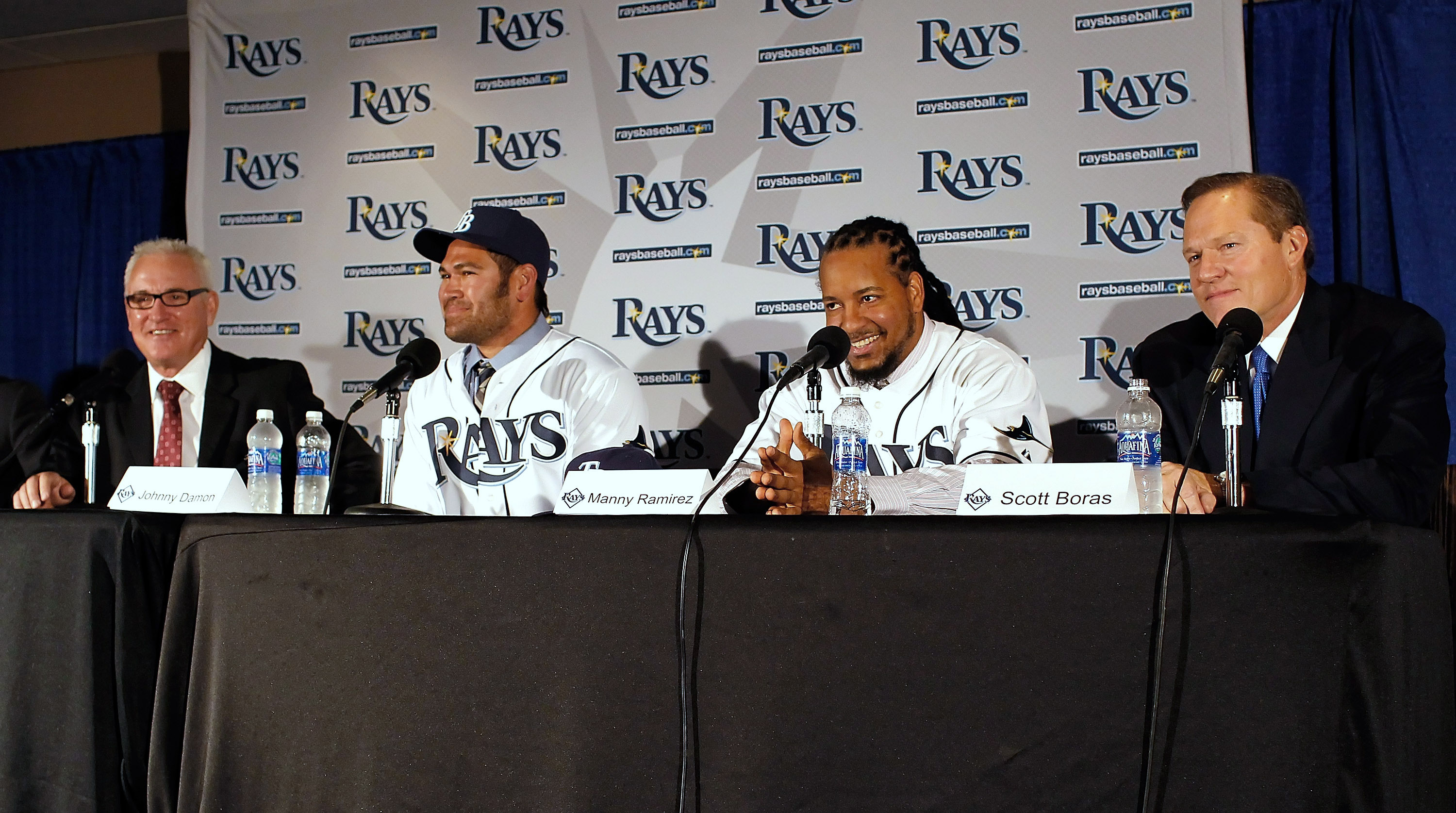 ST PETERSBURG, FL - FEBRUARY 01:  (L to R)  Tampa Bay Rays manager Joe Maddon, Johnny Damon #22 and Manny Ramirez #24 of the Tampa Bay Rays, and agent Scott Boras talk with reporters during a press conference at Tropicana Field on February 1, 2011 in St P