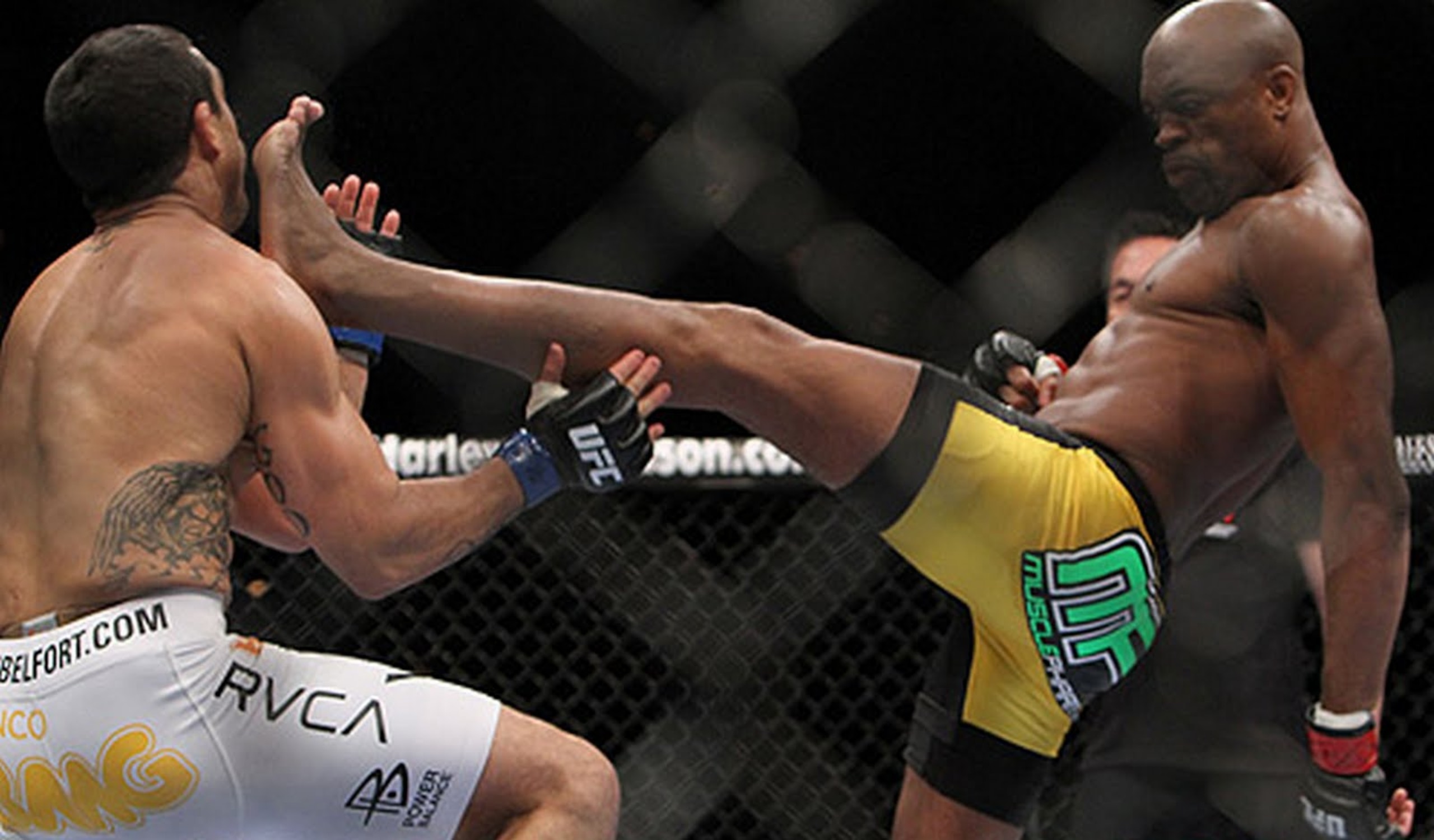 Anderson Silva drops Vitor Belfort with a perfectly thrown front kick to retain his title, making it an unprecedented eight consecutive title defenses of his crown. Anderson Silva drops Vitor Belfort with a perfectly thrown front kick to retain his title, making it an unprecedented eight consecutive title defenses of his crown.