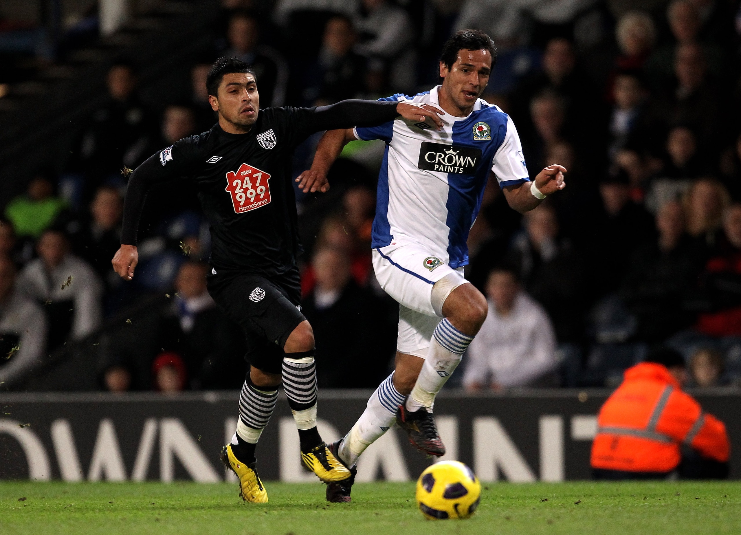 BLACKBURN, ENGLAND - JANUARY 23:  Roque Santa Cruz of Blackburn Rovers competes with Gonzalo Jara of West Bromwich Albion during the Barclays Premier League match between Blackburn Rovers and West Bromwich Albion at Ewood Park on January 23, 2011 in Black