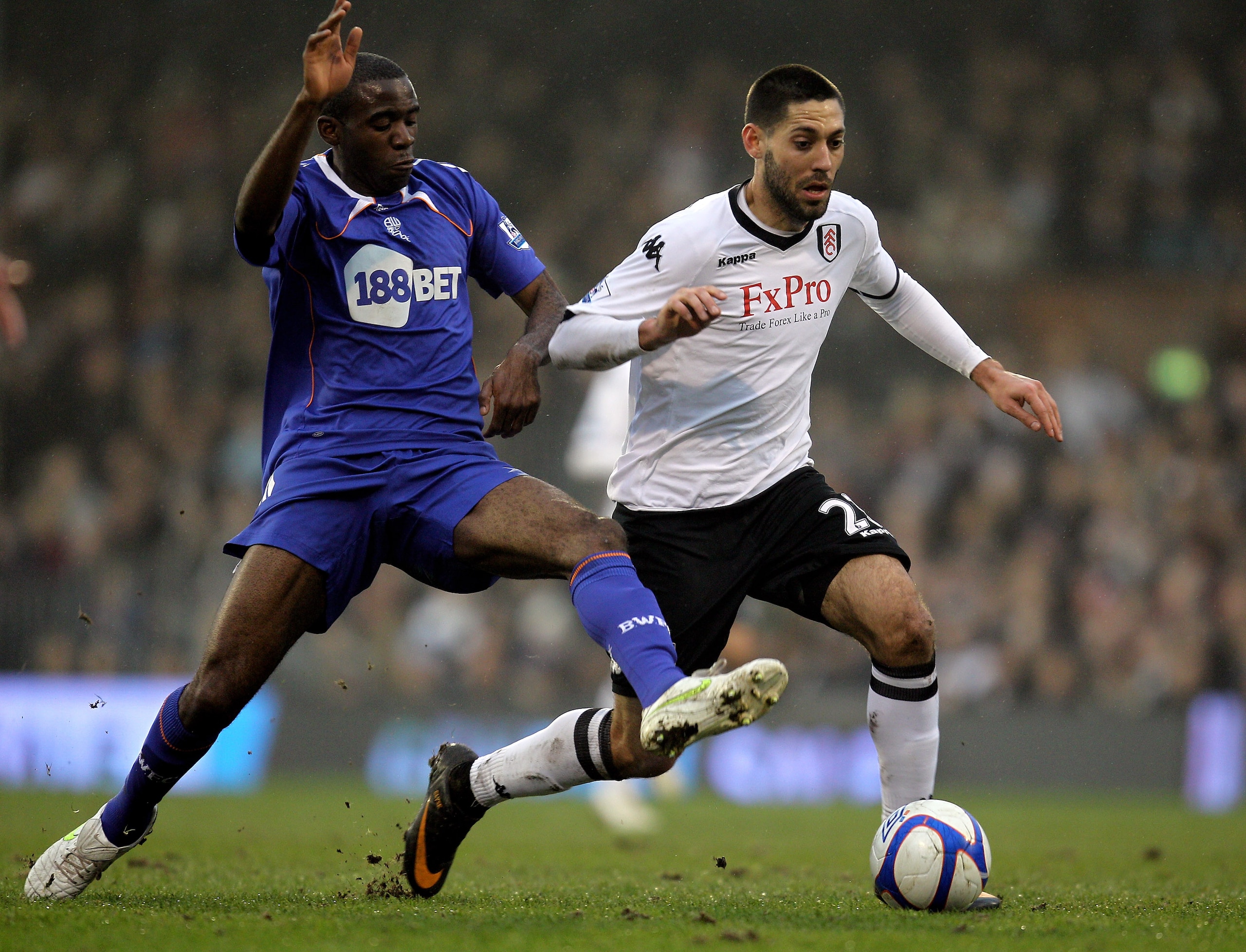 LONDON, ENGLAND - FEBRUARY 20:  Fabrice Muamba of Bolton (L) tackles Clint Dempsey of Fulham during the FA Cup sponsored by E.ON 5th Round match between Fulham and Bolton Wanderers at Craven Cottage on February 20, 2011 in London, England.  (Photo by Paul