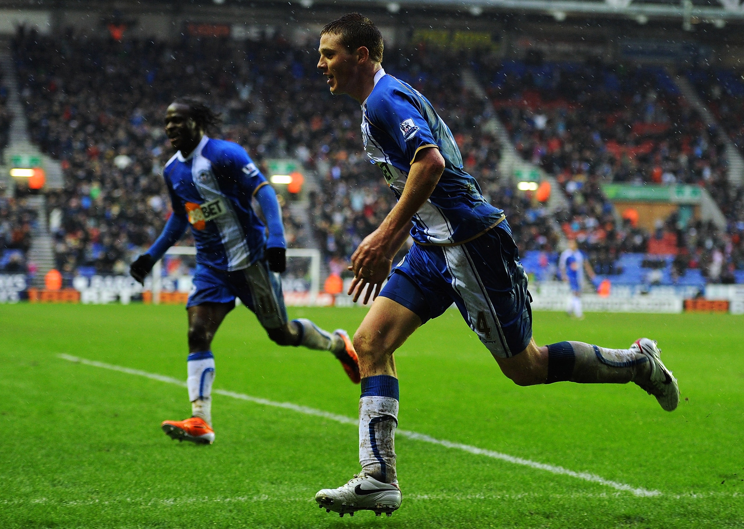 WIGAN, ENGLAND - FEBRUARY 05:  James McCarthy (R) of Wigan Athletic celebrates after scoring to make it 1-1 during the Barclays Premier League match between Wigan Athletic and Blackburn Rovers at DW Stadium on February 5, 2011 in Wigan, England.  (Photo b