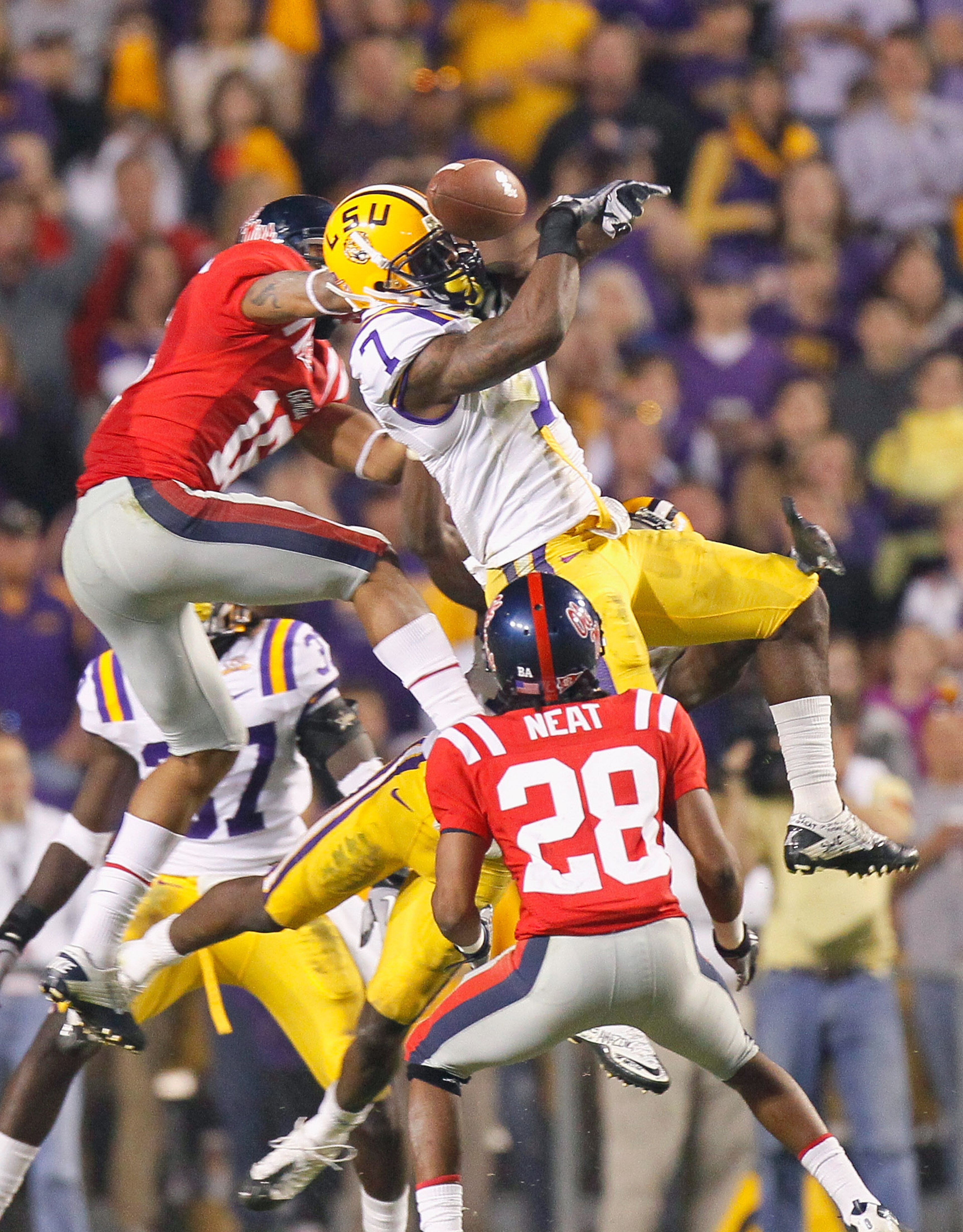 BATON ROUGE, LA - NOVEMBER 20:  Patrick Peterson #7 of the Louisiana State University Tigers nearly intercepts a pass in the final seconds against Markeith Summers #16 and Korvic Neat #28 of the Ole Miss Rebels as time expired at Tiger Stadium on November