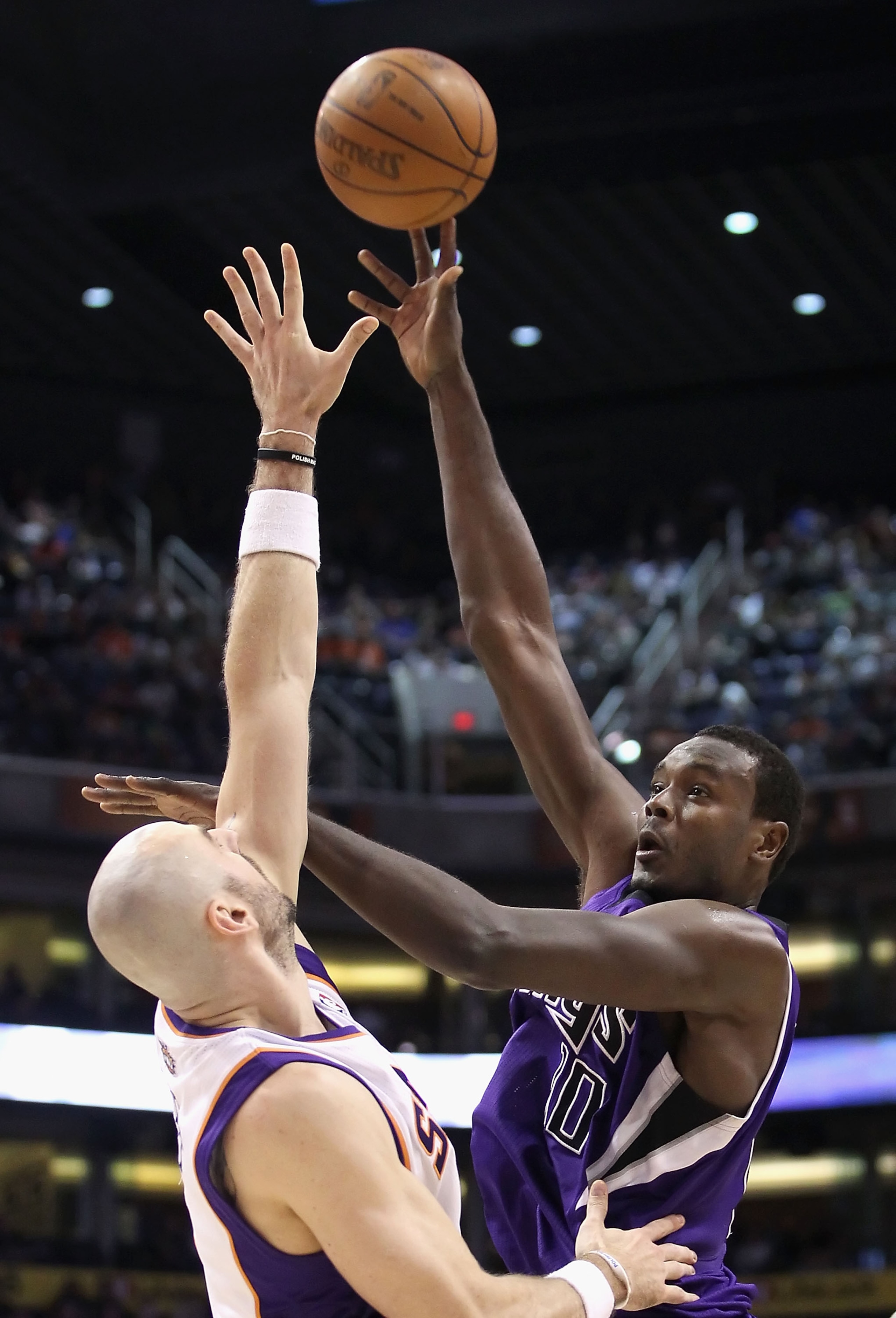 PHOENIX, AZ - FEBRUARY 13:  Samuel Dalembert #10 of the Sacramento Kings puts up a shot over Marcin Gortat #4 of the Phoenix Suns during the NBA game at US Airways Center on February 13, 2011 in Phoenix, Arizona. The Kings defeated the Suns 113-108.  NOTE