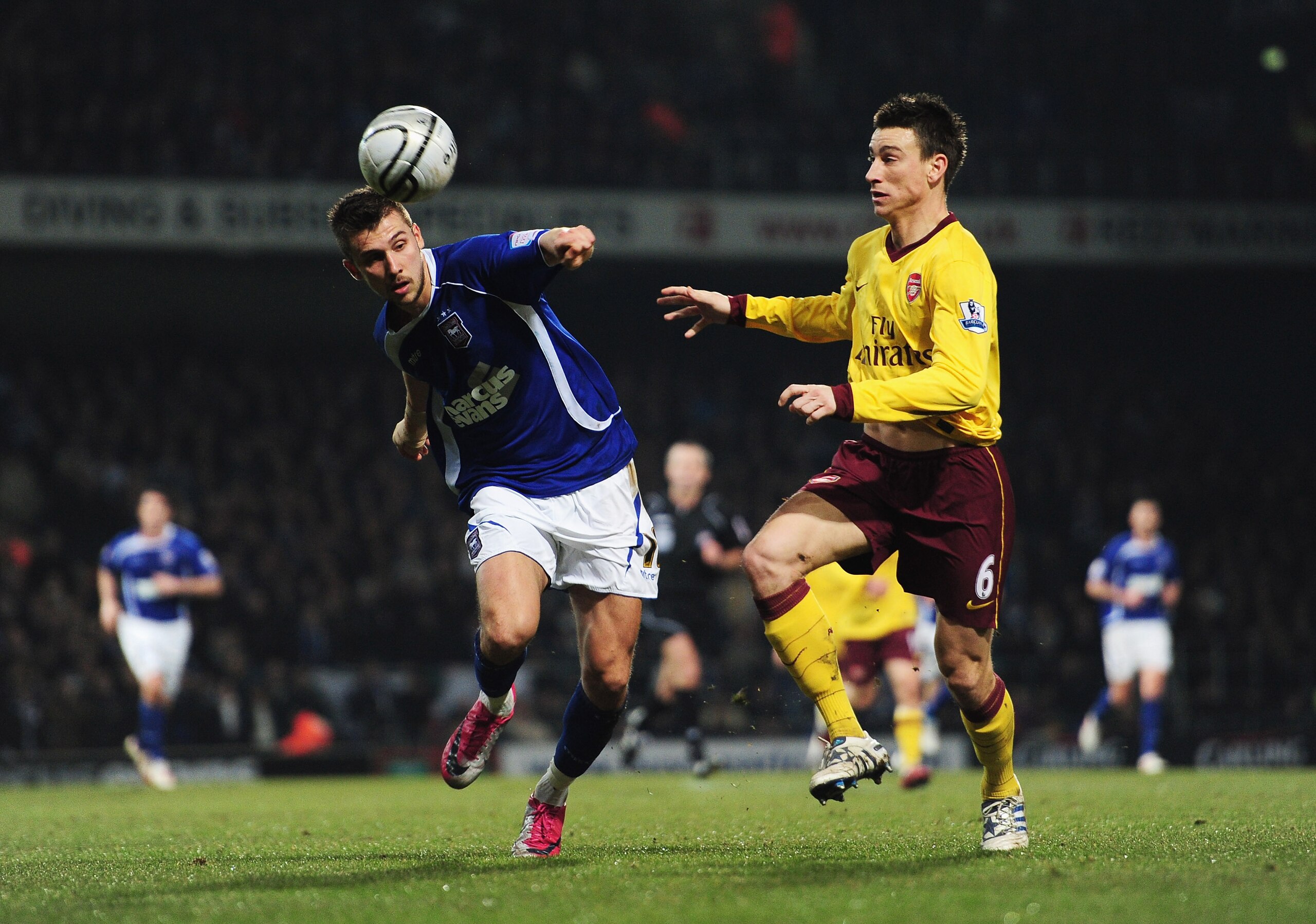 IPSWICH, ENGLAND - JANUARY 12:  Tamas Priskin of Ipswich Town is closed down by Laurent Koscielny of Arsenal during the Carling Cup Semi Final First Leg match between Ipswich Town and Arsenal at Portman Road on January 12, 2011 in Ipswich, England.  (Phot