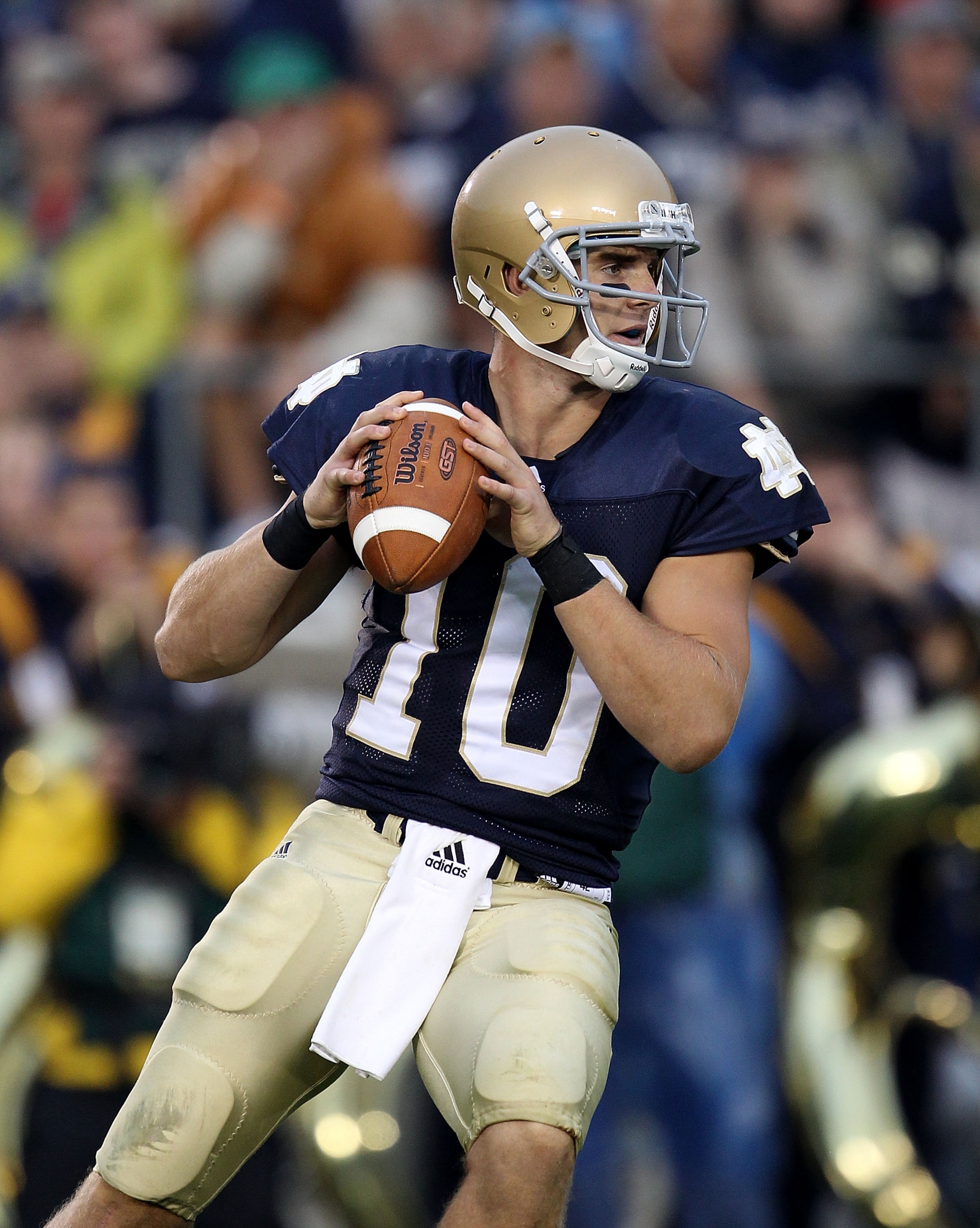 SOUTH BEND, IN - SEPTEMBER 11: Dayne Crist #10 of the Notre Dame Fighting Irish looks for a receiver in the 4th quarter against the Michigan Wolverines at Notre Dame Stadium on September 11, 2010 in South Bend, Indiana. Michigan defeated Notre Dame 28-24.