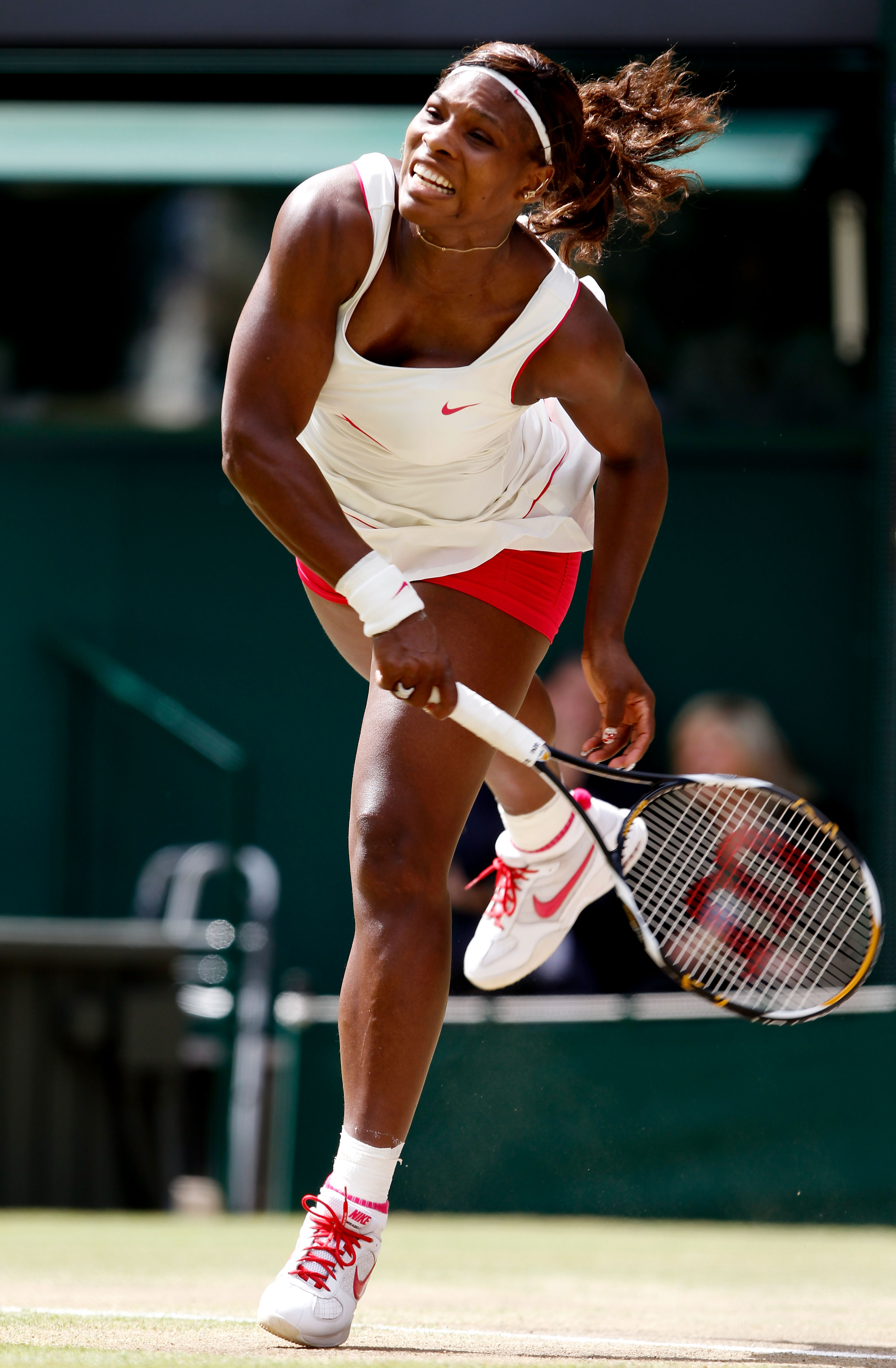 LONDON, ENGLAND - JULY 03:  Serena Williams of USA serves during the Ladies Singles Final Match against Vera Zvonareva of Russia on Day Twelve of the Wimbledon Lawn Tennis Championships at the All England Lawn Tennis and Croquet Club on July 3, 2010 in Lo