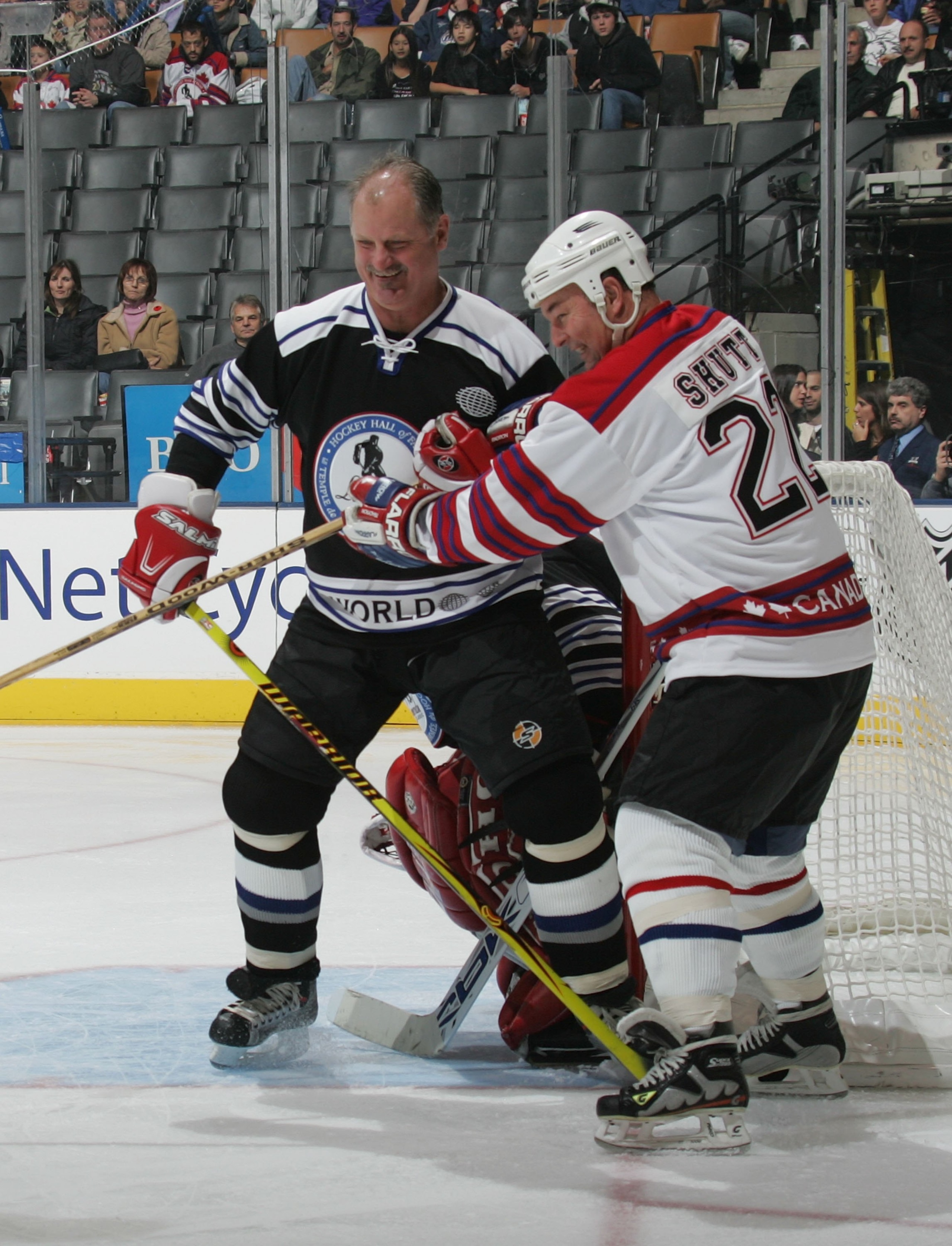 TORONTO - NOVEMBER 12:  Rod Langway #25 of Team World and Steve Shutt #22 of Team Canada battle in front of the net during the Hockey Hall of Fame Legends Classic game at the Air Canada Centre November 12, 2006 in Toronto, Ontario.  (Photo by Bruce Bennet