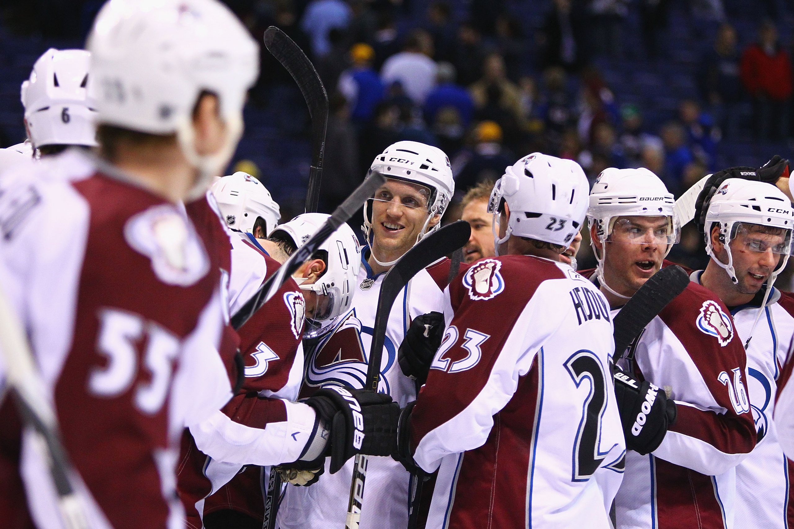 ST. LOUIS, MO - FEBRUARY 22: Jay McClement #16 of the Colorado Avalanche is congratulated by teammates after beating St. Louis Blues at the Scottrade Center on February 22, 2011 in St. Louis, Missouri.  It was McClement's first game back in St. Louis afte
