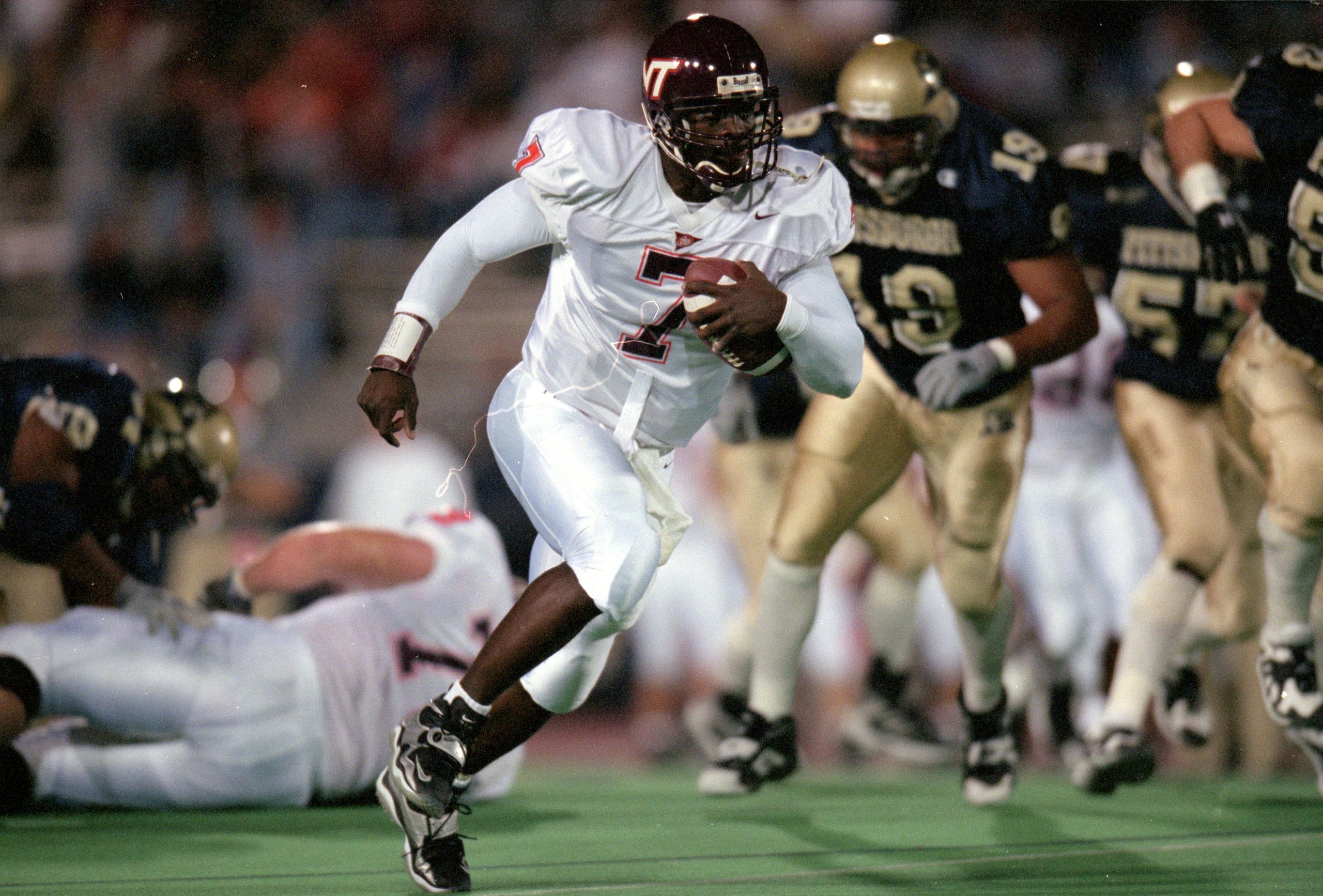 30 Oct 1999: Michael Vick #7 of the Virginia Tech Hokies carries the ball during the game against the Pittsburgh Panthers at the Pittsburgh Stadium in Pittsburgh, Pennsylvania. The Panthers defeated the Hokies 30-17. Mandatory Credit: Doug Pensinger  /All