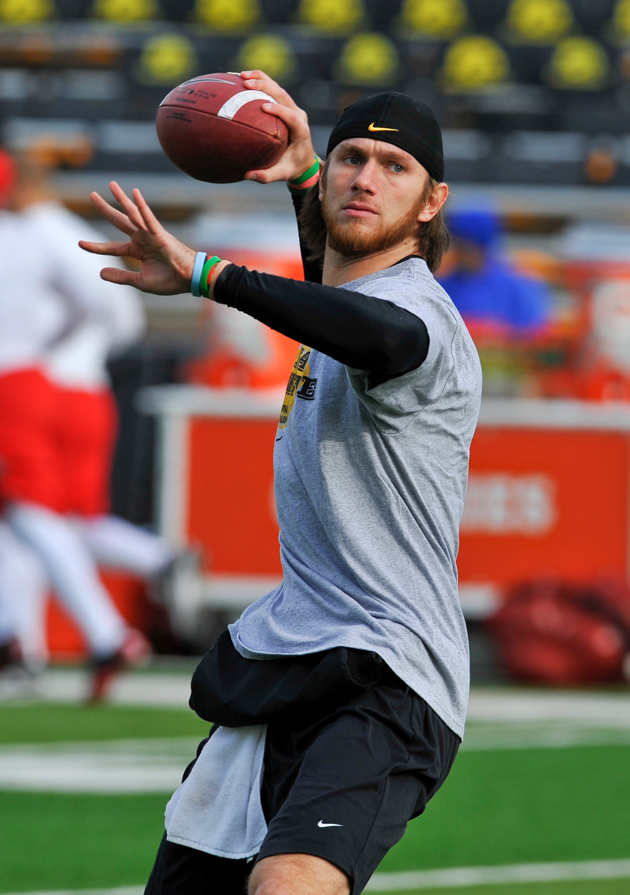 IOWA CITY, IA - NOVEMBER 20: Quarterback Ricky Stanzi #12 of the University of Iowa Hawkeyes throws  during pre game warm ups before the NCAA football game against the Ohio State Buckeyes at Kinnick Stadium on November 20, 2010 in Iowa City, Iowa. Ohio wo