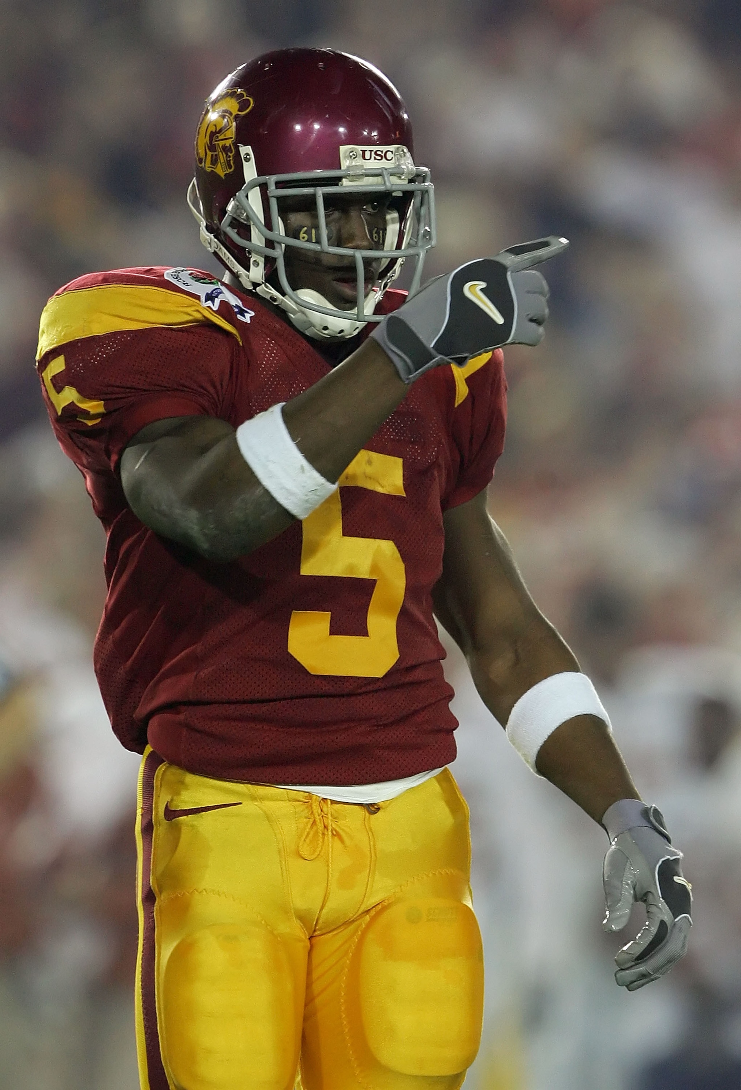 PASADENA, CA - JANUARY 04:  Reggie Bush #5 of the USC Trojans points to the sidelines during the first half of the BCS National Championship Rose Bowl Game against the Texas Longhorns at the Rose Bowl on January 4, 2006 in Pasadena, California.  (Photo by