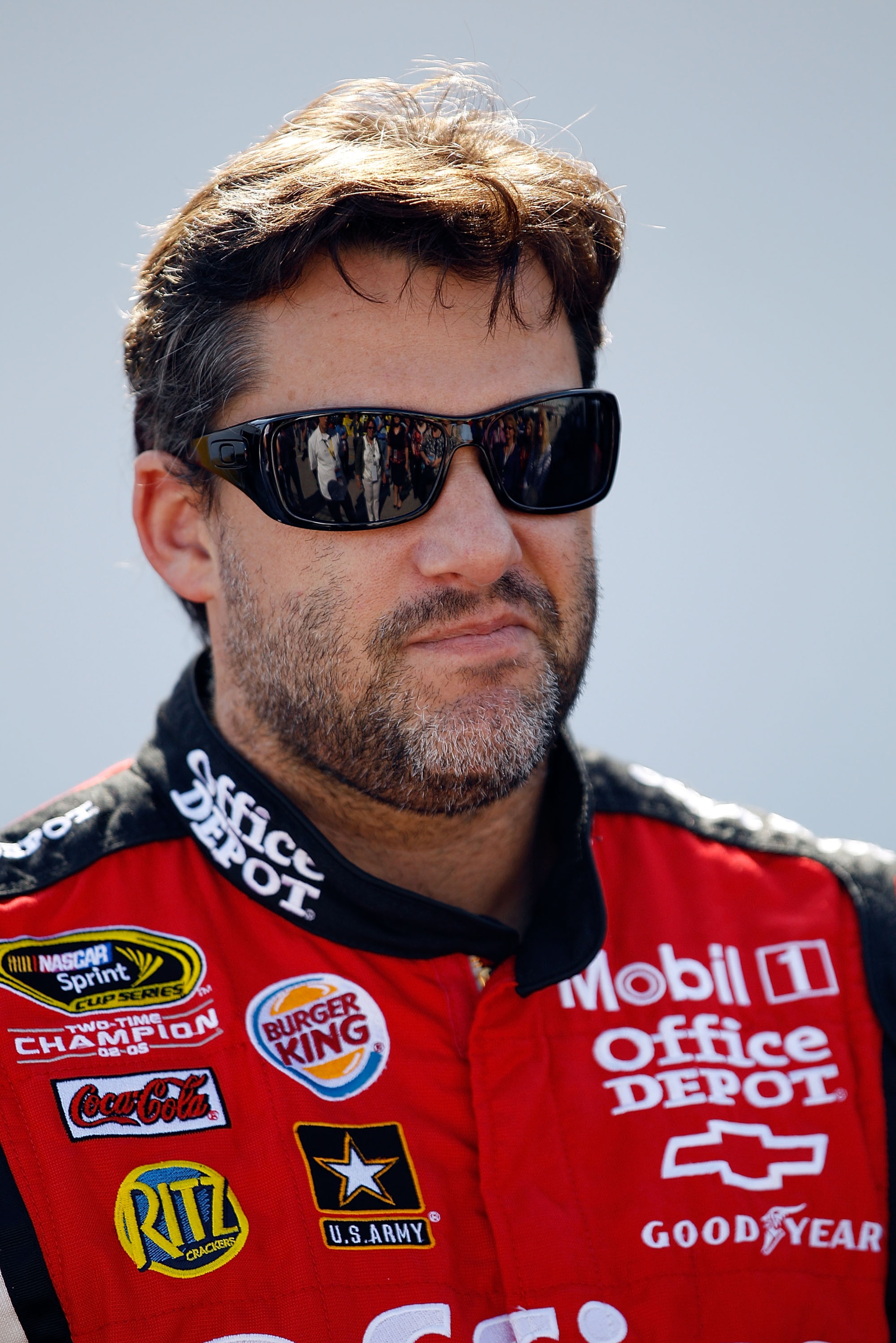 DAYTONA BEACH, FL - FEBRUARY 18:  Tony Stewart, driver of the #14 Mobil 1/Office Depot Chevrolet, looks on in the garage area during practice for the NASCAR Sprint Cup Series Daytona 500 at Daytona International Speedway on February 18, 2011 in Daytona Be