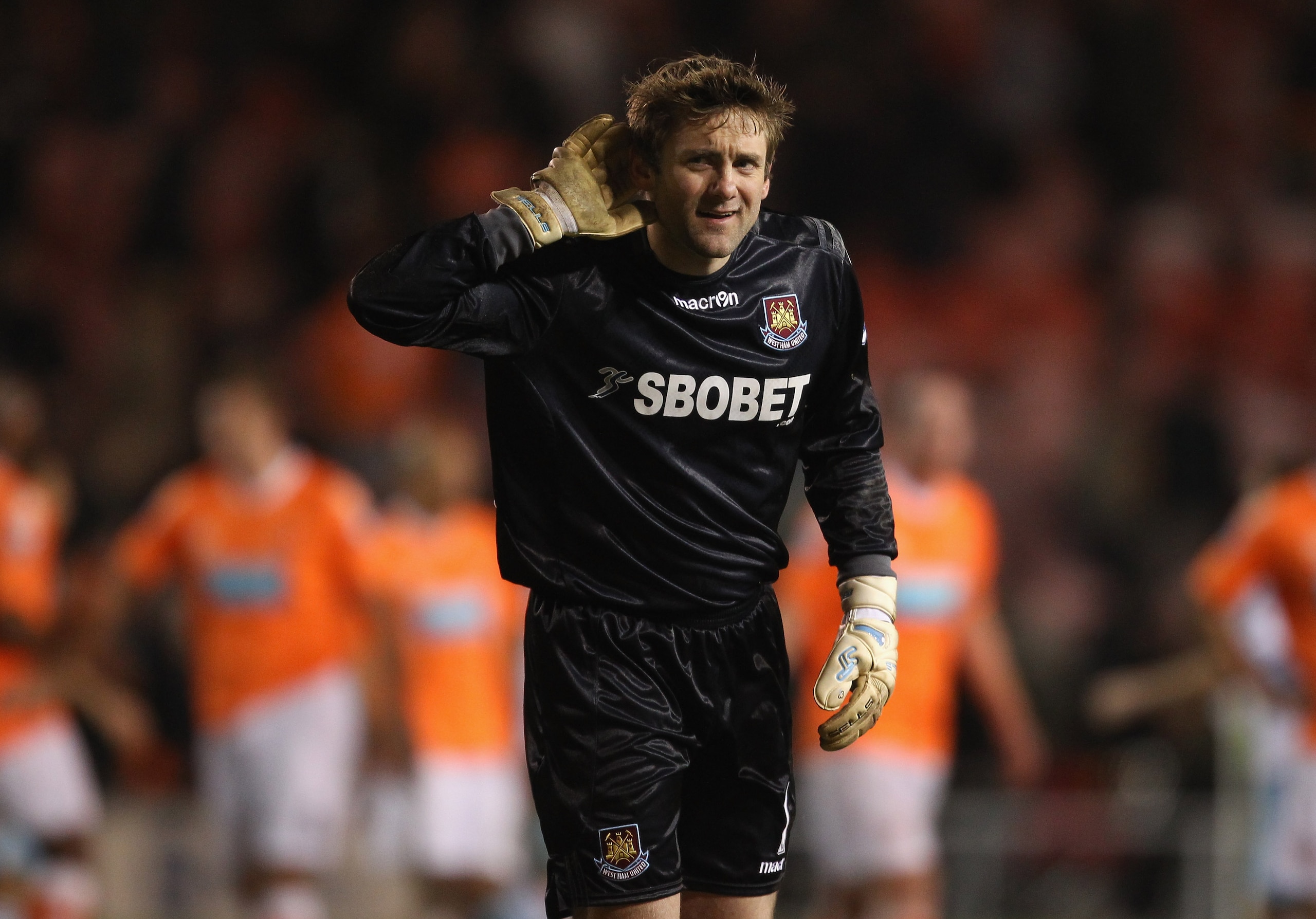 BLACKPOOL, ENGLAND - FEBRUARY 02:  Robert Green of West Ham United cups his ear towards the Blackpool fans after victory over Blackpool in the Barclays Premier League match between Blackpool and West Ham United at Bloomfield Road on February 2, 2011 in Bl