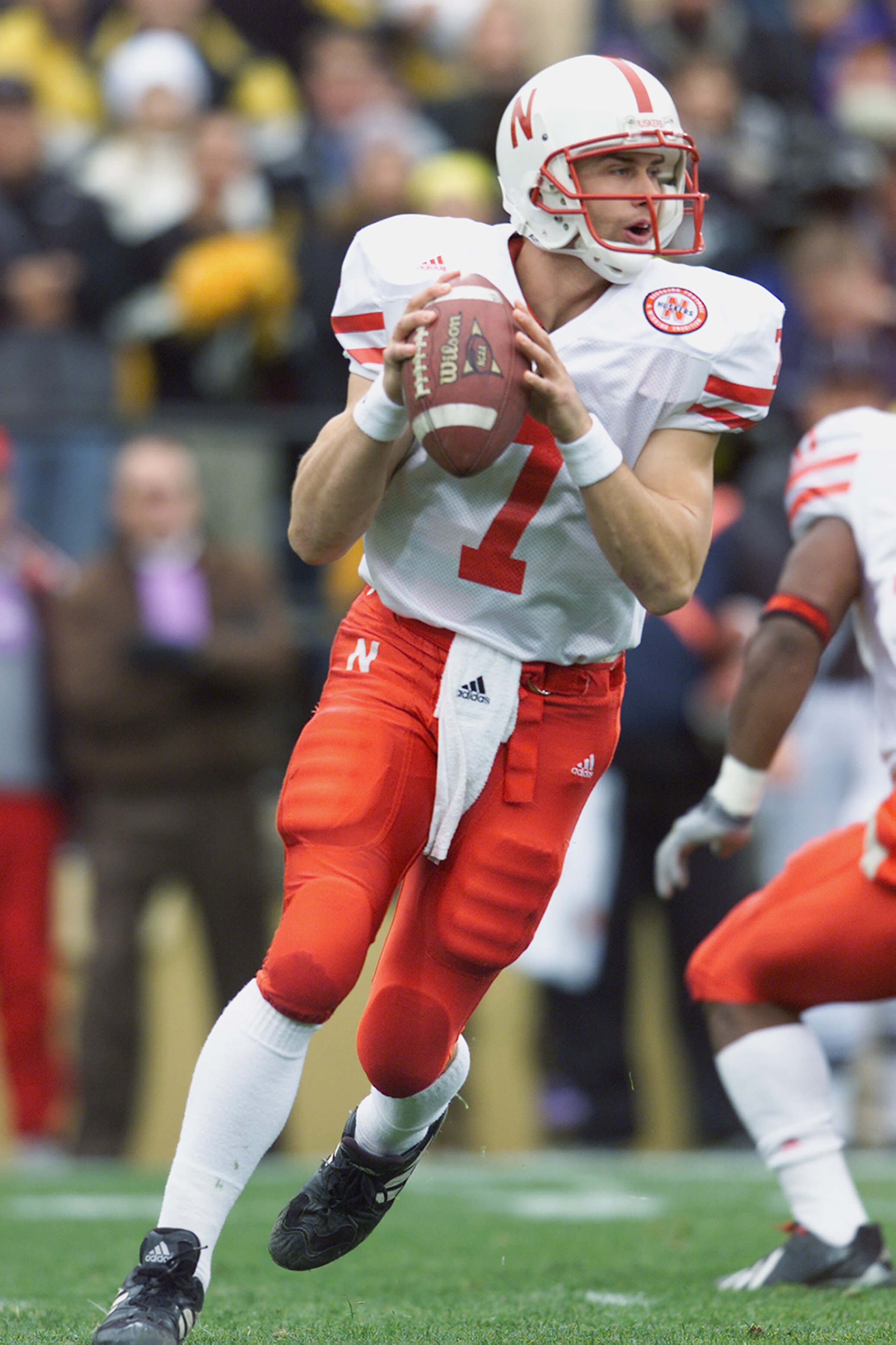 BOULDER, CO - NOVEMBER 23: Quarterback Eric Crouch #7 of the Nebraska Cornhuskers rolls to his right during the Big 12 Conference football game against the Colorado Buffaloes on November 23, 2001 at Folsom Field in Boulder, Colorado. The Buffaloes crush BOULDER, CO - NOVEMBER 23: Quarterback Eric Crouch #7 of the Nebraska Cornhuskers rolls to his right during the Big 12 Conference football game against the Colorado Buffaloes on November 23, 2001 at Folsom Field in Boulder, Colorado. The Buffaloes crush