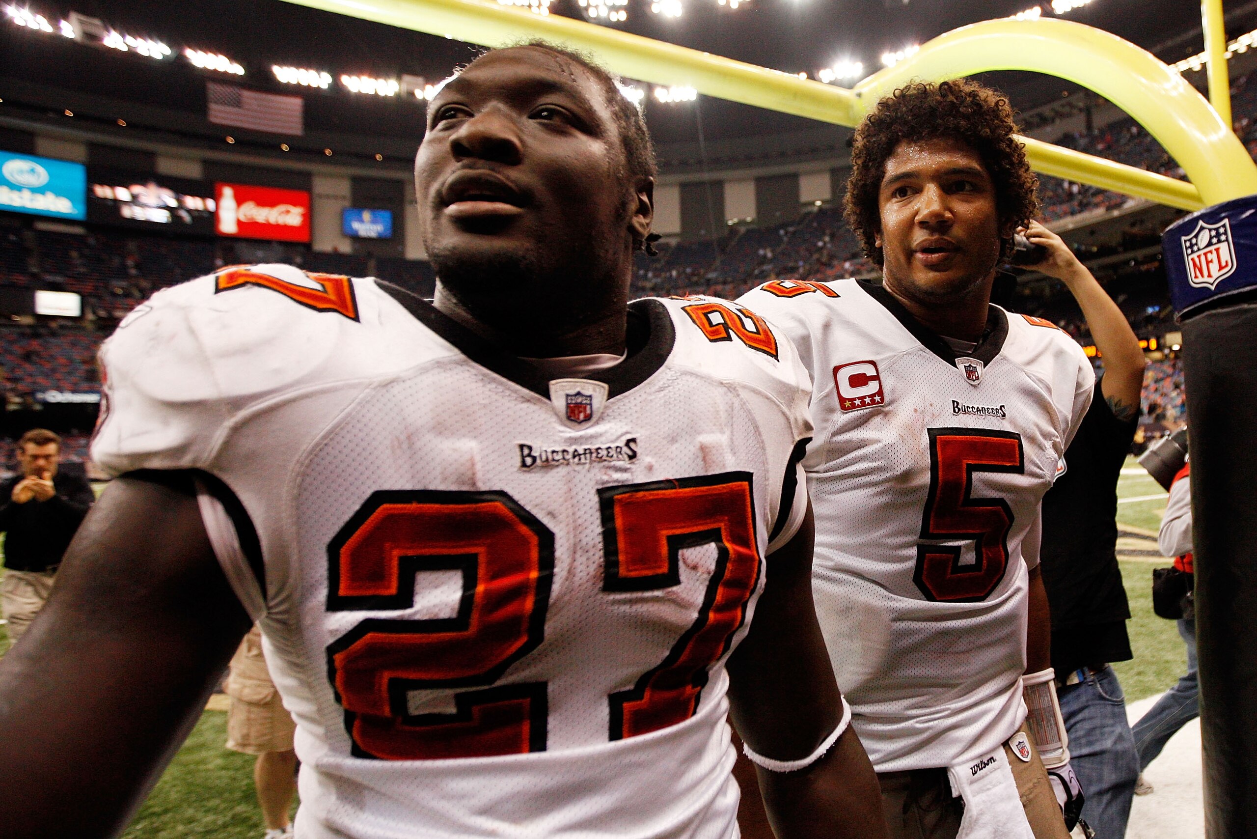 NEW ORLEANS, LA - JANUARY 02:  Quarterback Josh Freeman #5  celebrates with LeGarrette Blount #27 of the Tampa Bay Buccaneers after defeating the New Orleans Saints 23-13 at the Louisiana Superdome on January 2, 2011 in New Orleans, Louisiana.  (Photo by