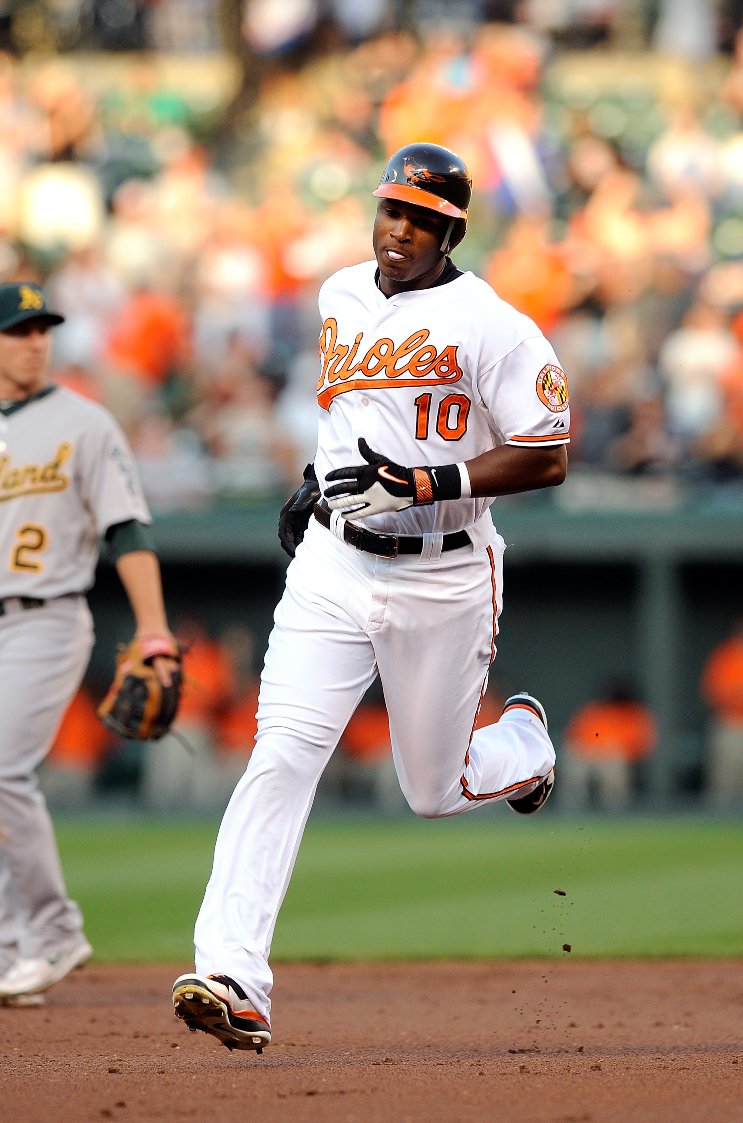 BALTIMORE - JUNE 30:  Adam Jones #10 of the Baltimore Orioles rounds the bases after hitting a home run in the second inning against the Oakland Athletics at Camden Yards on June 30, 2010 in Baltimore, Maryland.  (Photo by Greg Fiume/Getty Images)