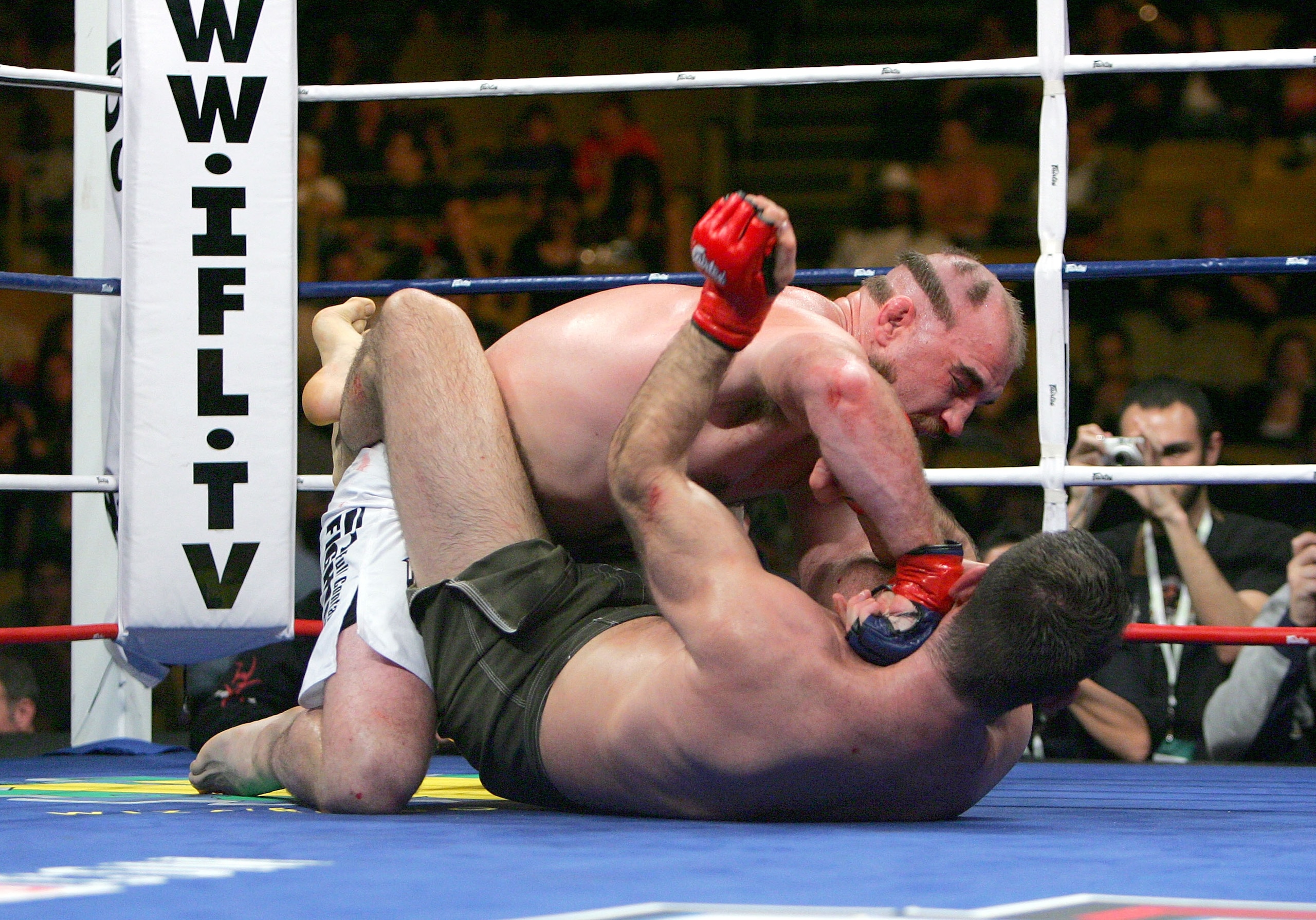 INGLEWOOD, CA - MARCH 17:  Brian Ebersole of Team Razorclaws (white trunks) lands a right puch to Alex Schoenauer of Team Anaconda (green trunks) during the International Fighting League at The Forum on March 17, 2007 in Inglewood, California.  (Photo by