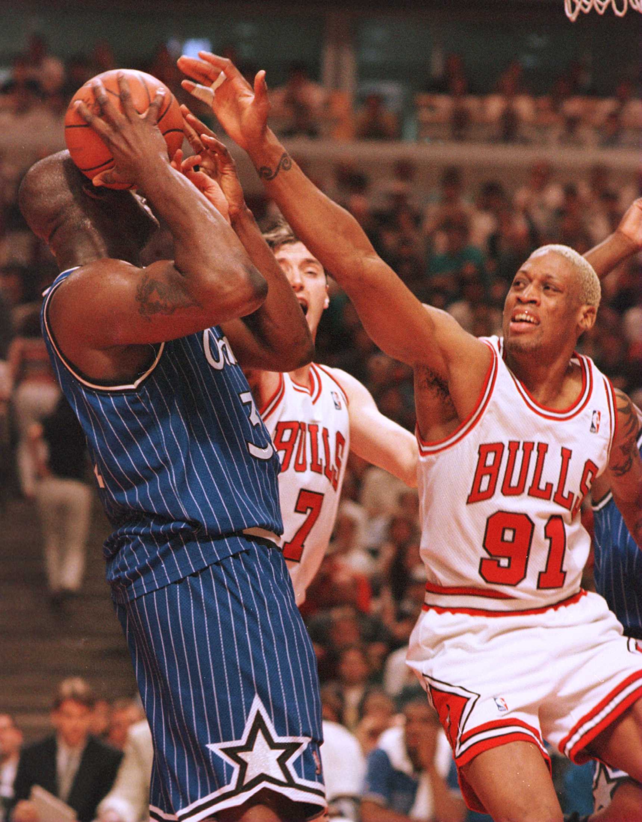 19 May 1996: Forward Dennis Rodman of the Chicago Bulls defends against center Shaquille O''Neal of the Orlando Magic during the third quarter of game one of the Eastern Conference Championships at the United Center in Chicago, Illinois. The Bulls went on