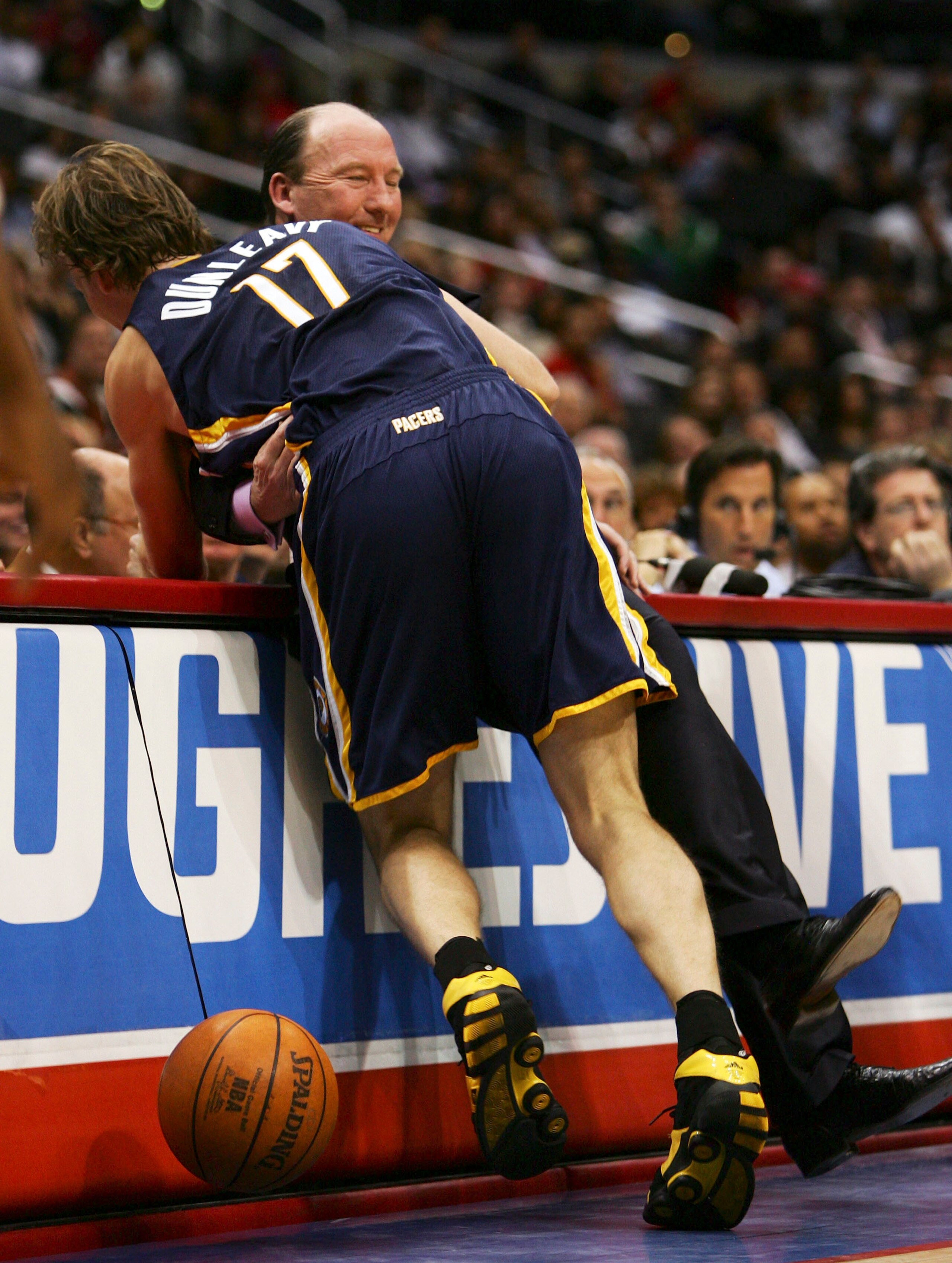LOS ANGELES, CA - MARCH 03:  Mike Dunleavy Jr. #17 of the Indiana Pacers collides with father and Head Coach Mike Dunleavy of the Los Angeles Clippers during the second quarter at the Staples Center on March 3, 2007 in Los Angeles, California.  NOTE TO US