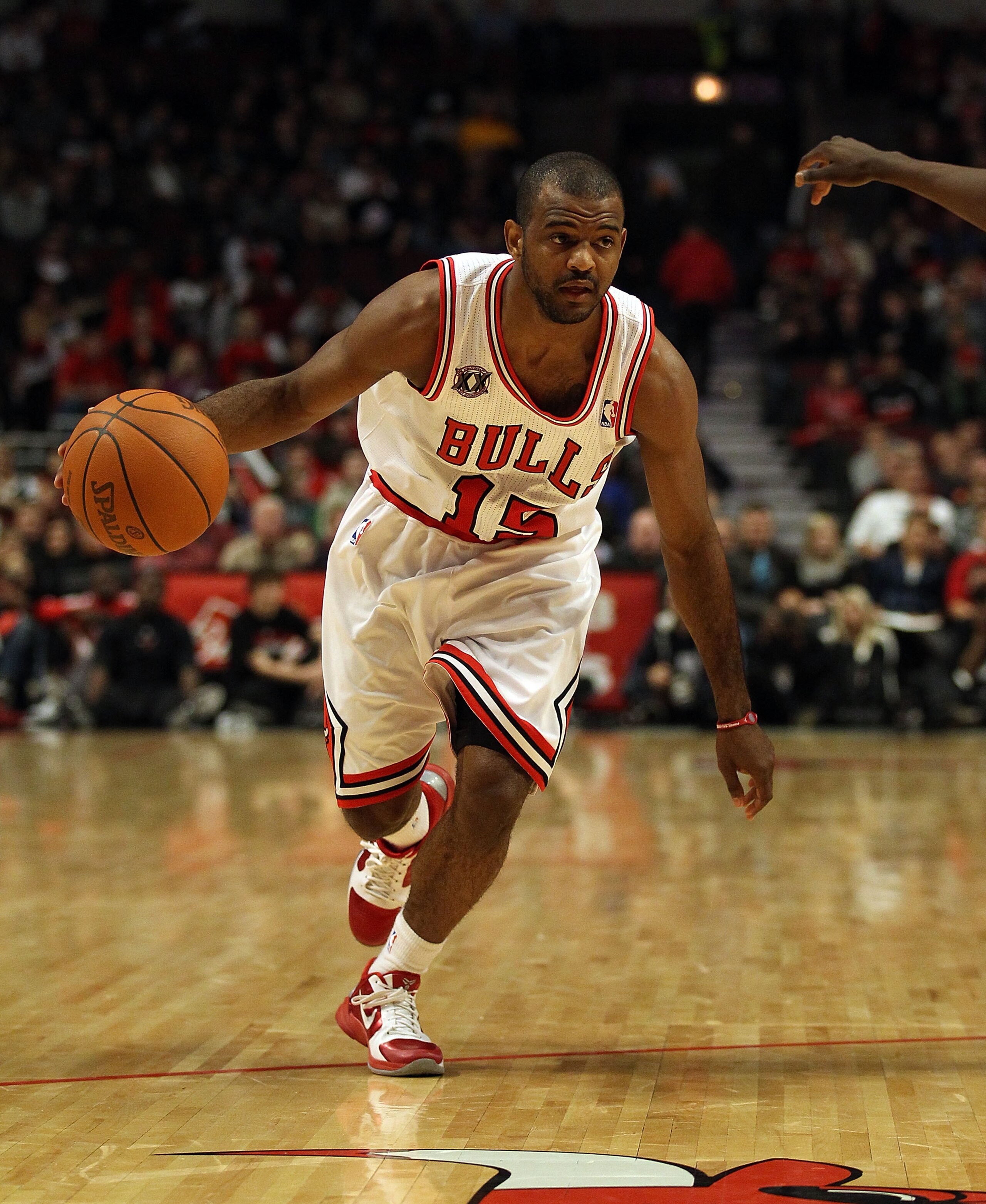 CHICAGO, IL - DECEMBER 21: John Lucas III #15 of the Chicago Bulls moves against the Philadelphia 76ers at the United Center on December 21, 2010 in Chicago, Illinois. The Bulls defeated the 76ers 121-76. NOTE TO USER: User expressly acknowledges and agre