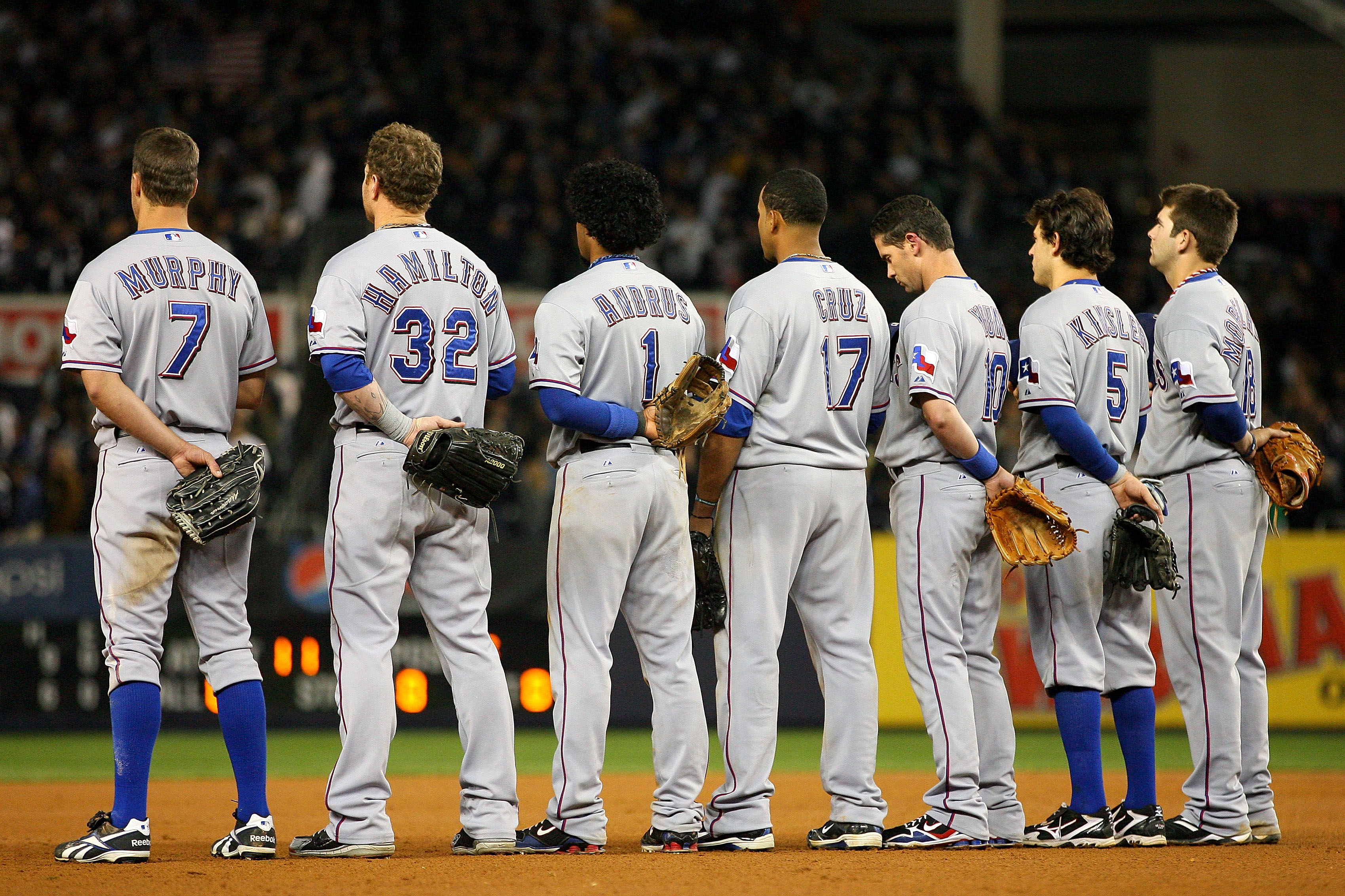 NEW YORK - OCTOBER 19:  (L-R) David Murphy #7, Josh Hamilton #32, Elvis Andrus #1, Nelson Cruz #17, Michael Young #10, Ian Kinsler #5 and Mitch Moreland #18 of the Texas Rangers stand for the performance of 'God Bless America' during the seventh inning ag