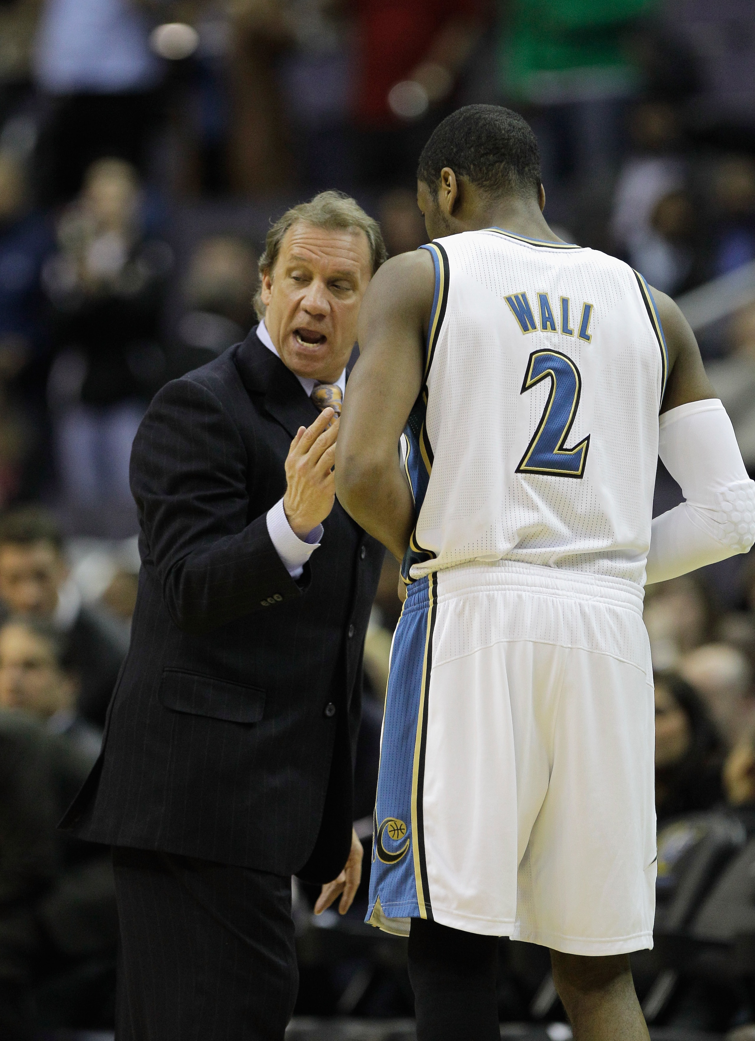 WASHINGTON, DC - FEBRUARY 26: Washington Wizards head coach Flip Saunders talks with player John Wall #2 against the Dallas Mavericksat the Verizon Center on February 26, 2011 in Washington, DC. NOTE TO USER: User expressly acknowledges and agrees that, b