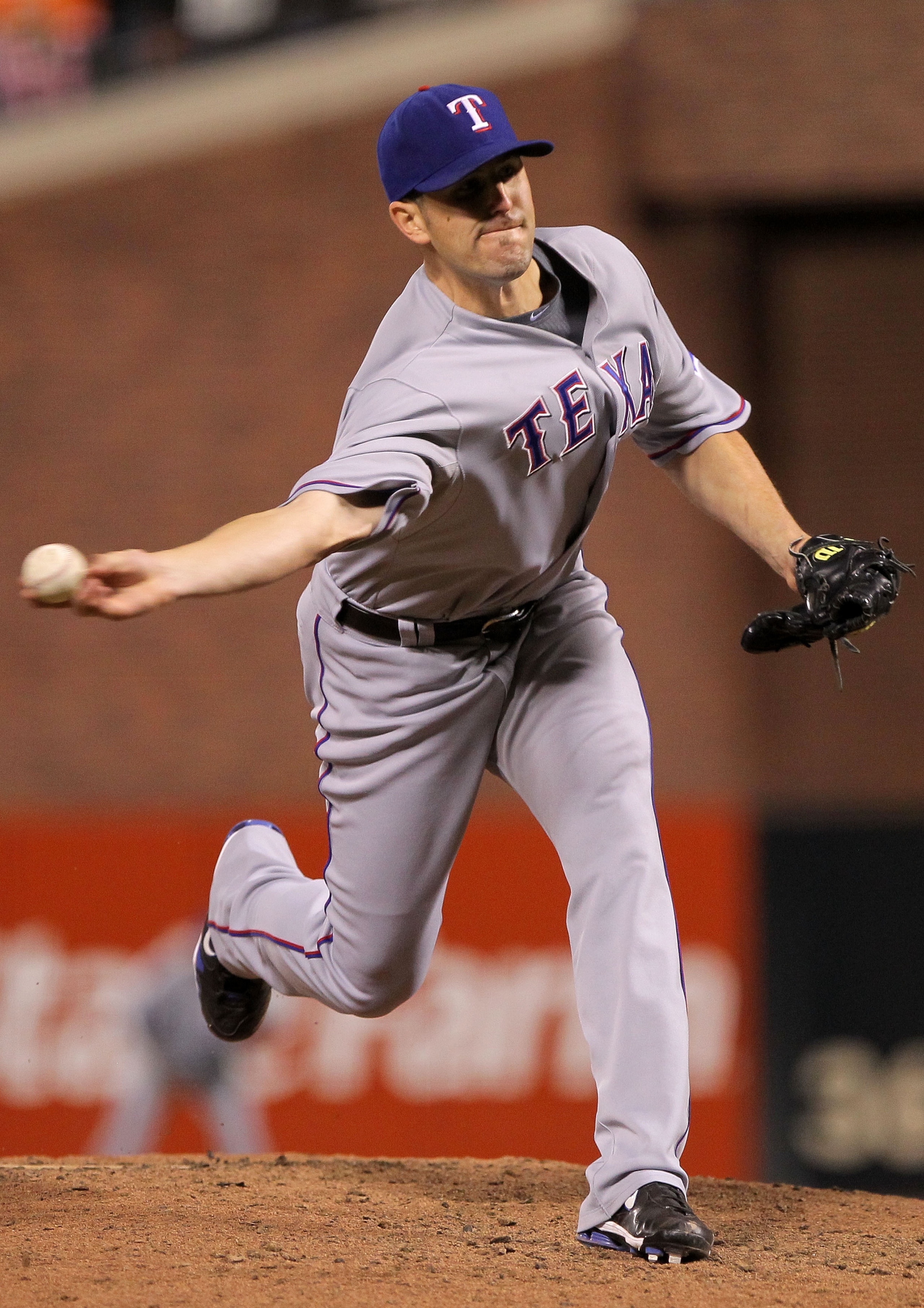 SAN FRANCISCO - OCTOBER 28:  Darren O'Day #56 of the Texas Rangers pitches in the eighth inning while taking on the San Francisco Giants in Game Two of the 2010 MLB World Series at AT&T Park on October 28, 2010 in San Francisco, California.  (Photo by Dou