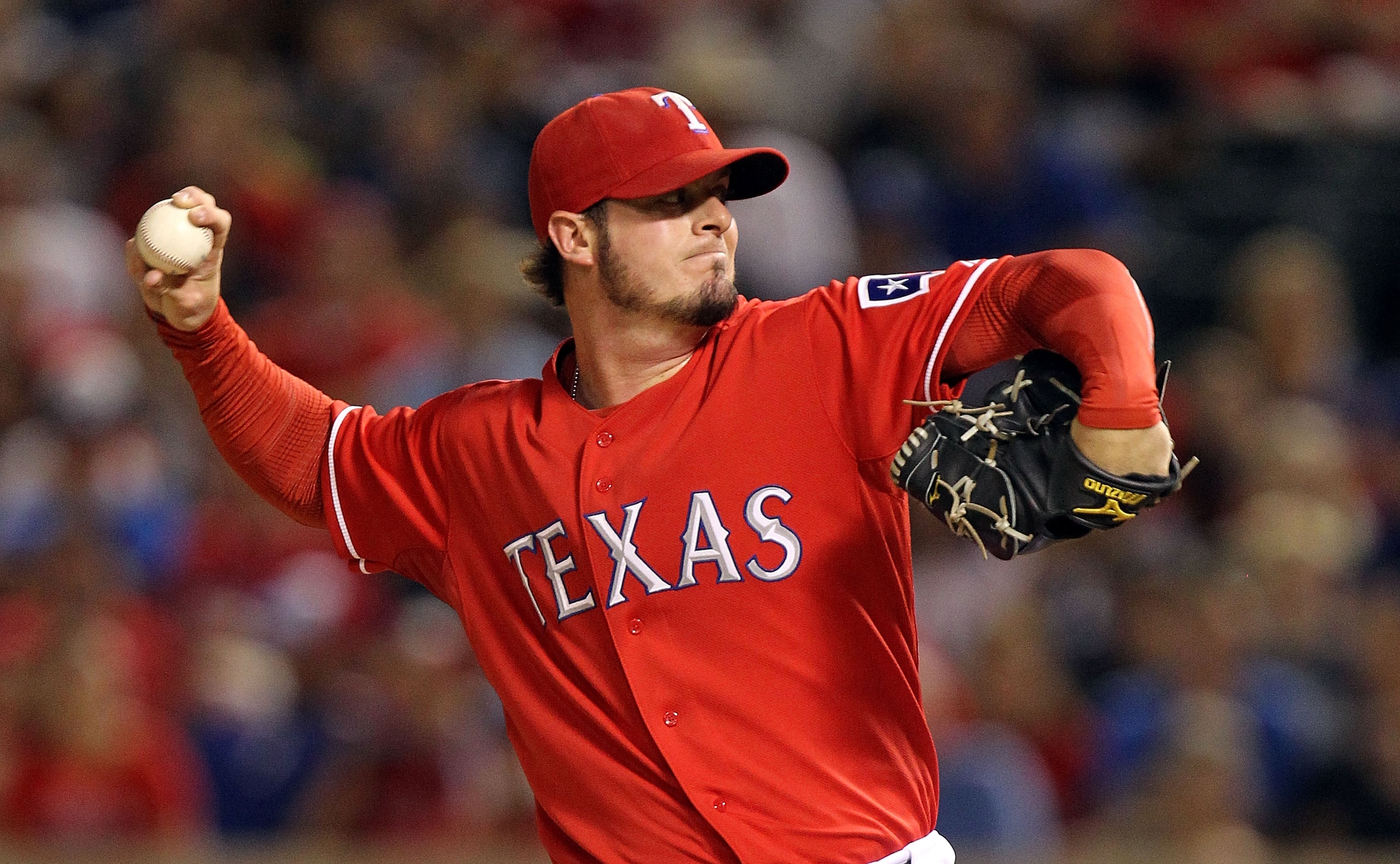 ARLINGTON, TX - OCTOBER 01:  Pitcher Mark Lowe #49 of the Texas Rangers thows against the Los Angeles Angels of Anaheim at Rangers Ballpark in Arlington on October 1, 2010 in Arlington, Texas.  (Photo by Ronald Martinez/Getty Images)