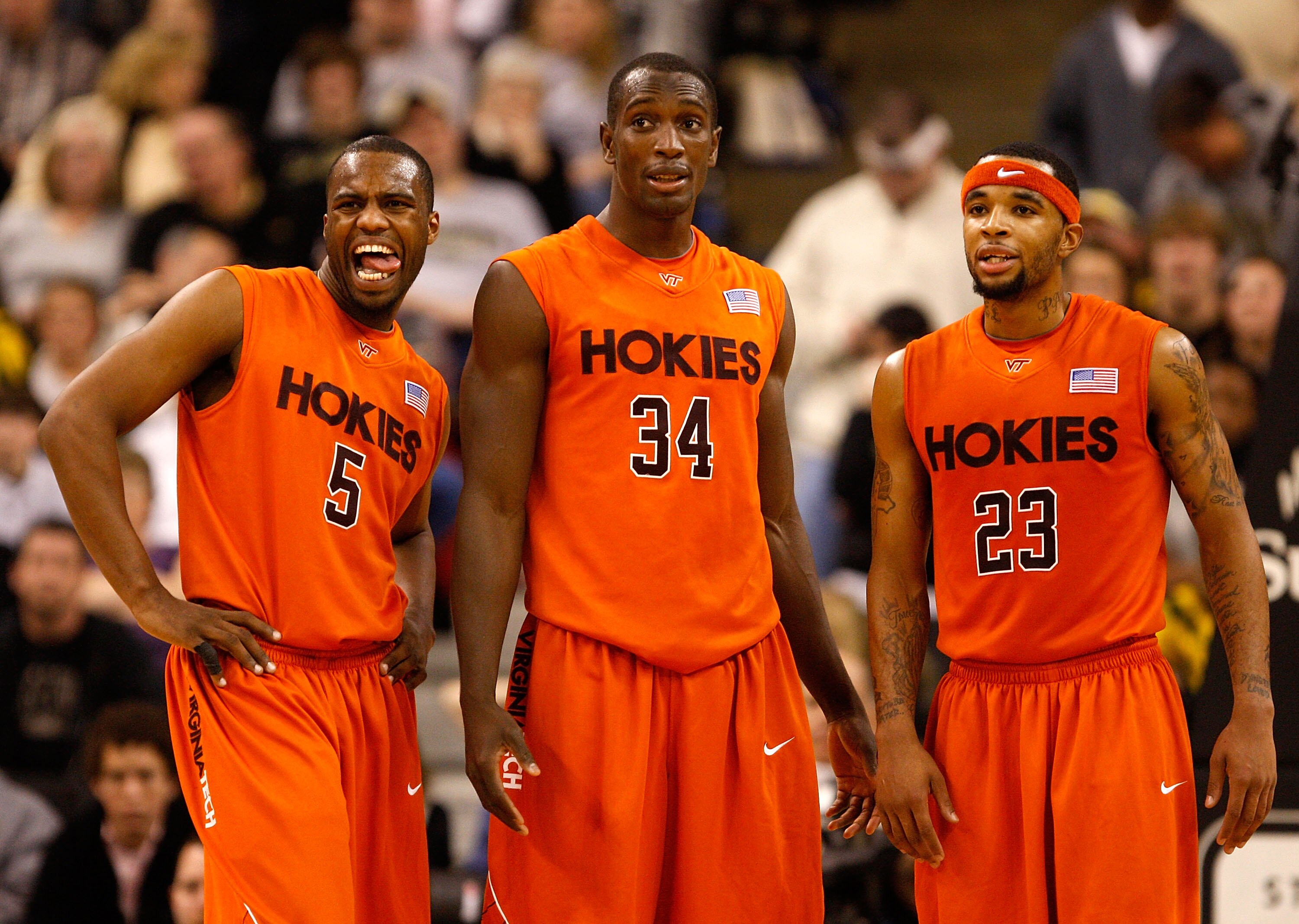 WINSTON-SALEM, NC - JANUARY 21:  Teammates Dorenzo Hudson #5 Cheick Diakite #34 and Malcolm Delaney #23 of the Virginia Tech Hokies watch on as a teammate shoots free throws to defeat the Wake Forest Demon Deacons 78-71 during their game at Lawrence Joel