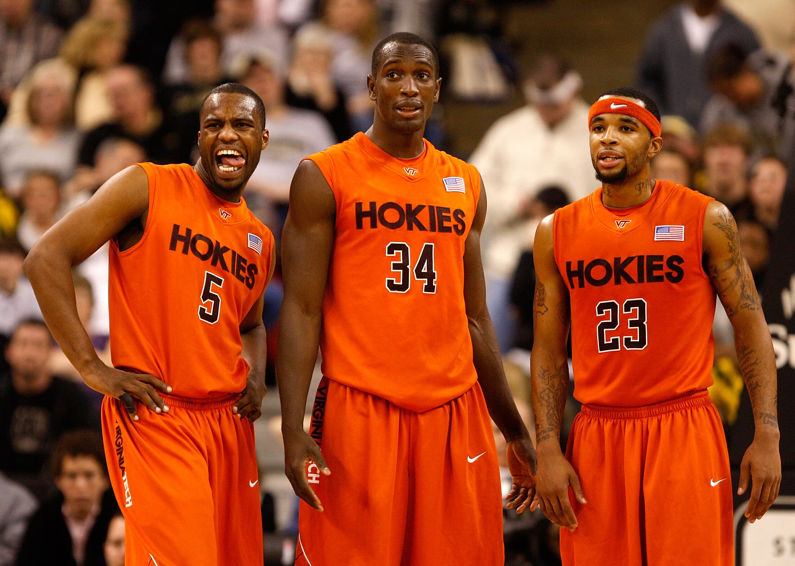 WINSTON-SALEM, NC - JANUARY 21:  Teammates Dorenzo Hudson #5 Cheick Diakite #34 and Malcolm Delaney #23 of the Virginia Tech Hokies watch on as a teammate shoots free throws to defeat the Wake Forest Demon Deacons 78-71 during their game at Lawrence Joel