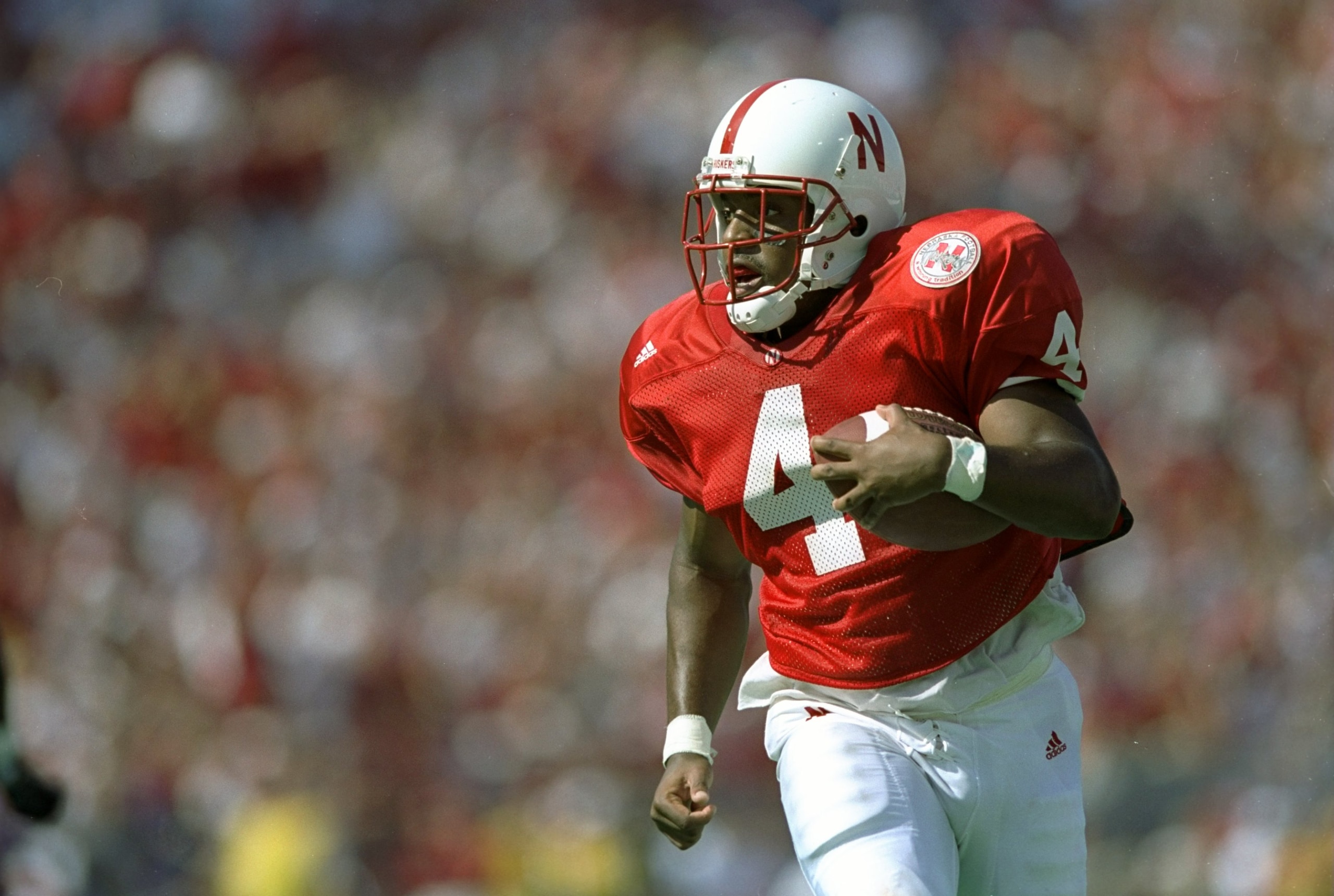 26 Sep 1998: Tailback DeAngelo Evans #4 of the Nebraska Cornhuskers runs with the ball during a game against the Washington Huskies at the Memorial Stadium in Lincoln, Nebraska. The Cornhuskers defeated the Huskies 55-7. Mandatory Credit: Harry How /All 26 Sep 1998: Tailback DeAngelo Evans #4 of the Nebraska Cornhuskers runs with the ball during a game against the Washington Huskies at the Memorial Stadium in Lincoln, Nebraska. The Cornhuskers defeated the Huskies 55-7. Mandatory Credit: Harry How /All