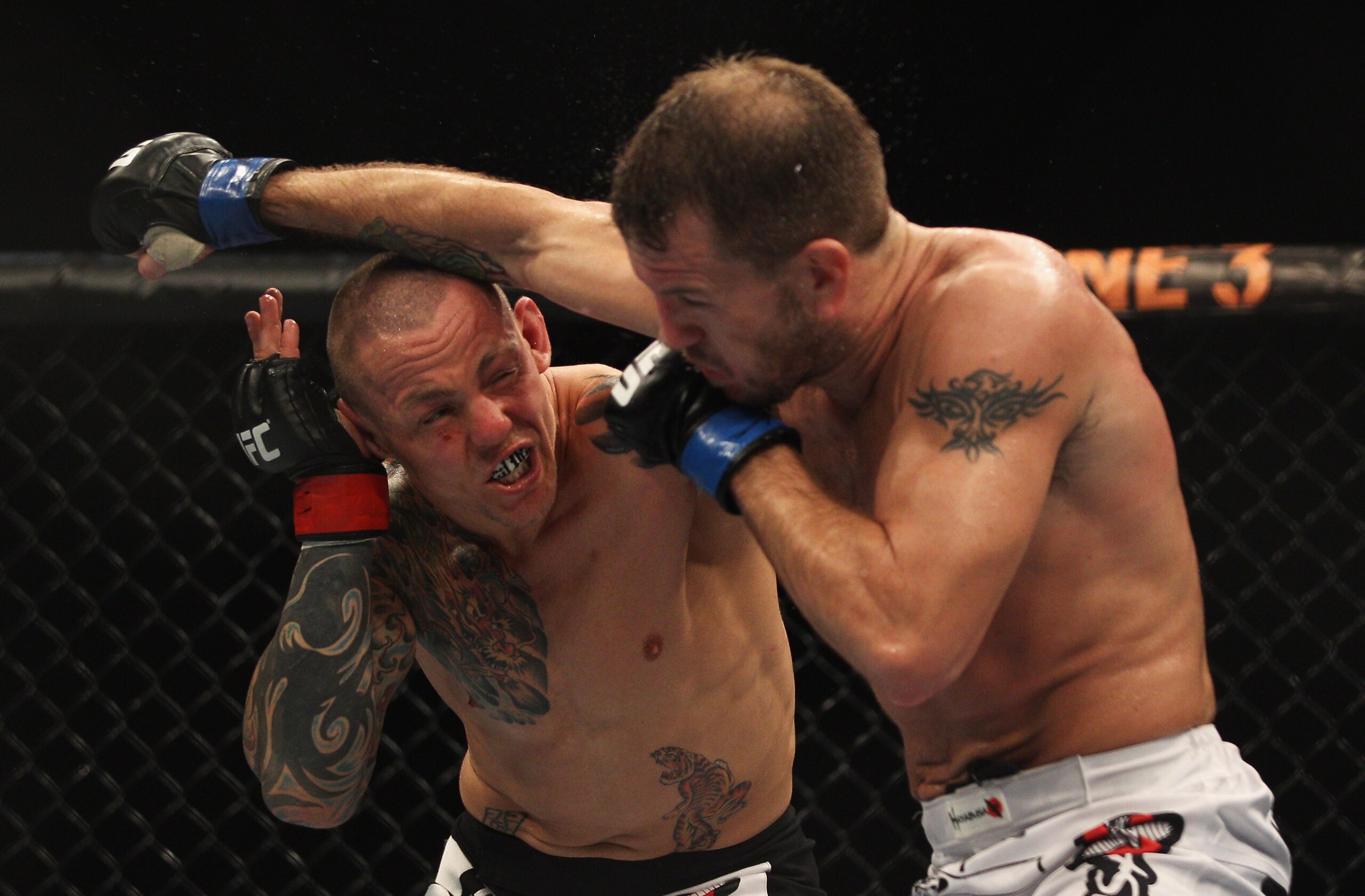 SYDNEY, AUSTRALIA - FEBRUARY 27:  Ross Pearson of Great Britain punches Spencer Fisher of the USA during their Lightweight bout UFC 127 at Acer Arena on February 27, 2011 in Sydney, Australia.  (Photo by Mark Kolbe/Getty Images)