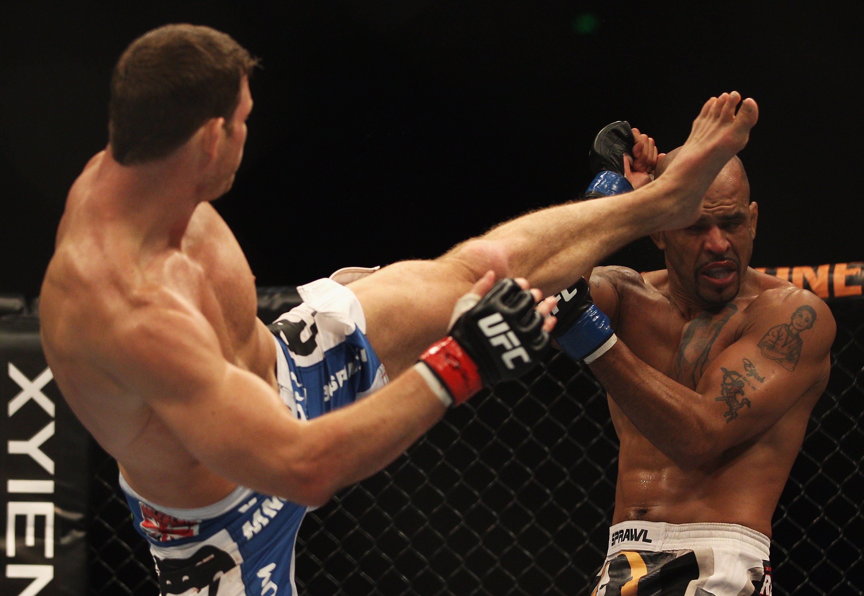 SYDNEY, AUSTRALIA - FEBRUARY 27:  Michael Bisping of Great Britain kicks Jorge Rivera of the USA in their middleweight bout part of at UFC 127 at Acer Arena on February 27, 2011 in Sydney, Australia.  (Photo by Mark Kolbe/Getty Images)