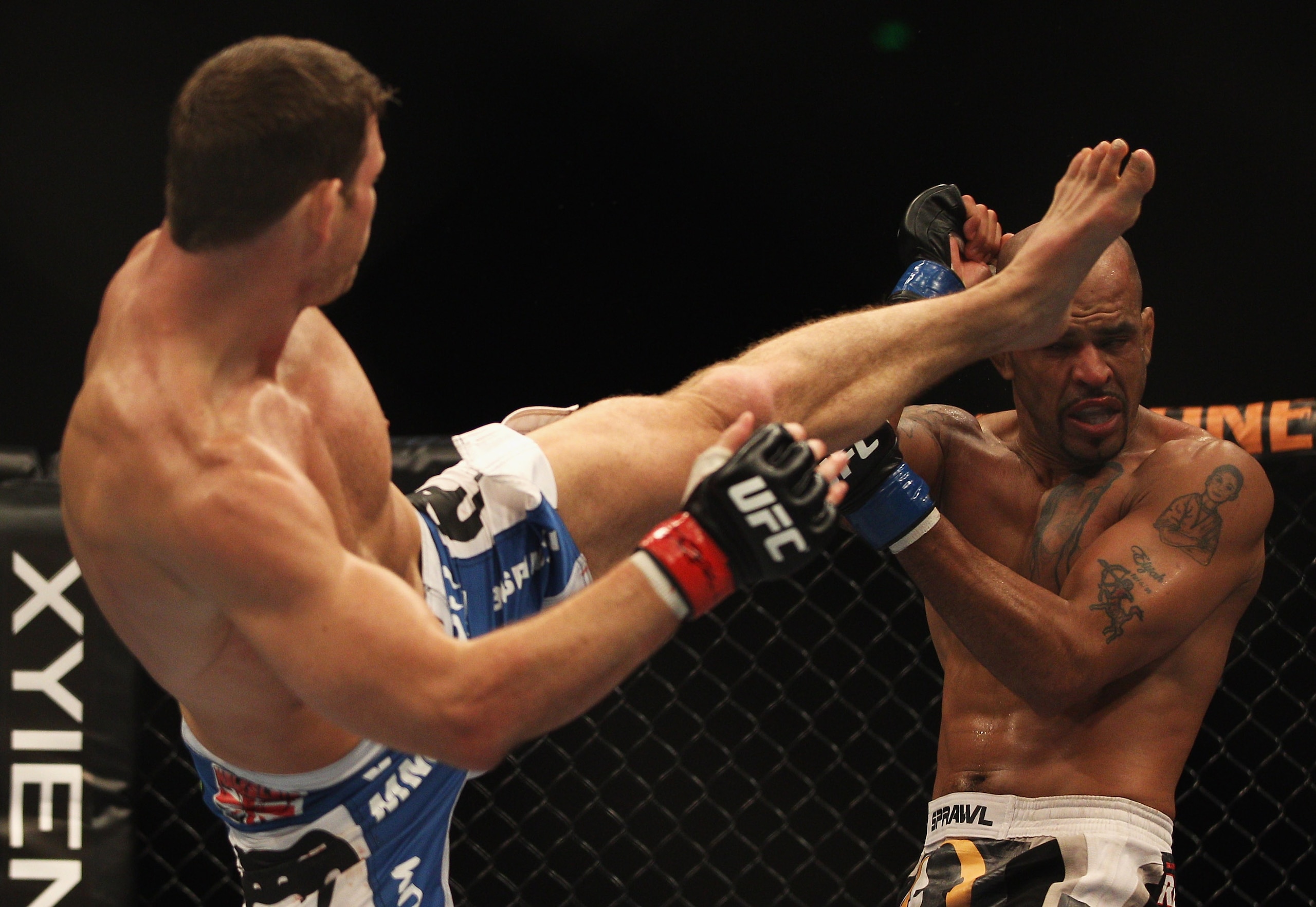 SYDNEY, AUSTRALIA - FEBRUARY 27:  Michael Bisping of Great Britain kicks Jorge Rivera of the USA in their middleweight bout part of at UFC 127 at Acer Arena on February 27, 2011 in Sydney, Australia.  (Photo by Mark Kolbe/Getty Images)