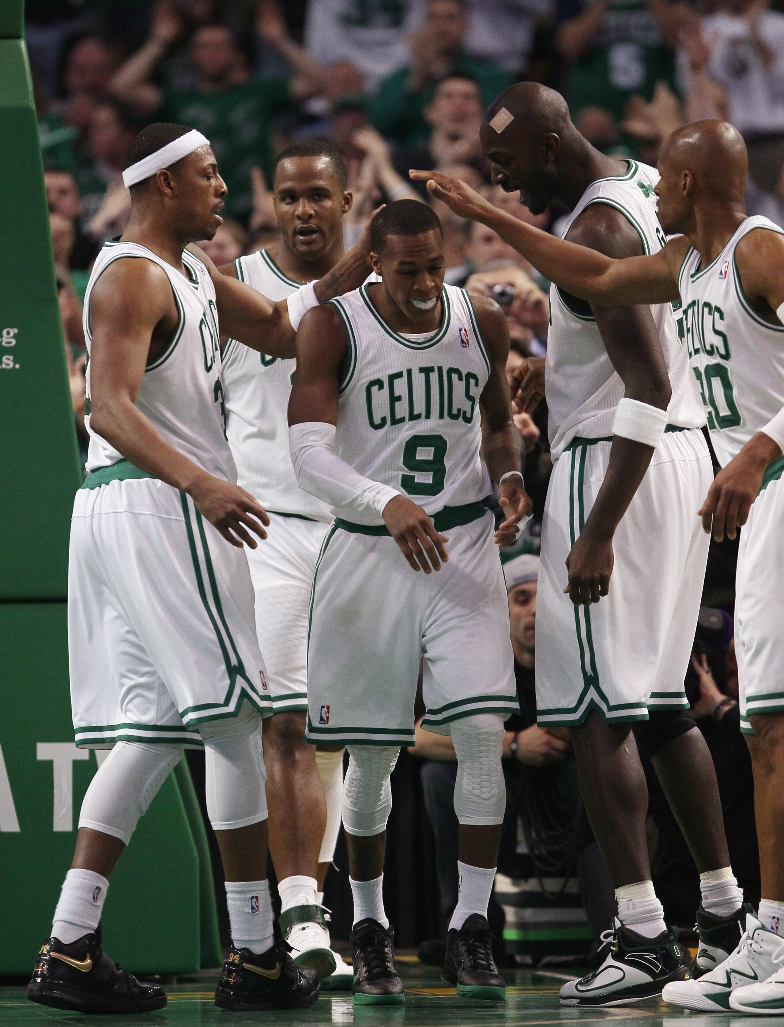 BOSTON, MA - FEBRUARY 06: Rajon Rondo #9 of the Boston Celtics is congratulated by teammates Paul Pierce #23,Glen Davis #11,Kevin Garnett #5 and Ray Allen #20 after Rondo drew the foul in the second half agianst the Orlando Magic on February 6, 2011 at t BOSTON, MA - FEBRUARY 06: Rajon Rondo #9 of the Boston Celtics is congratulated by teammates Paul Pierce #23,Glen Davis #11,Kevin Garnett #5 and Ray Allen #20 after Rondo drew the foul in the second half agianst the Orlando Magic on February 6, 2011 at t
