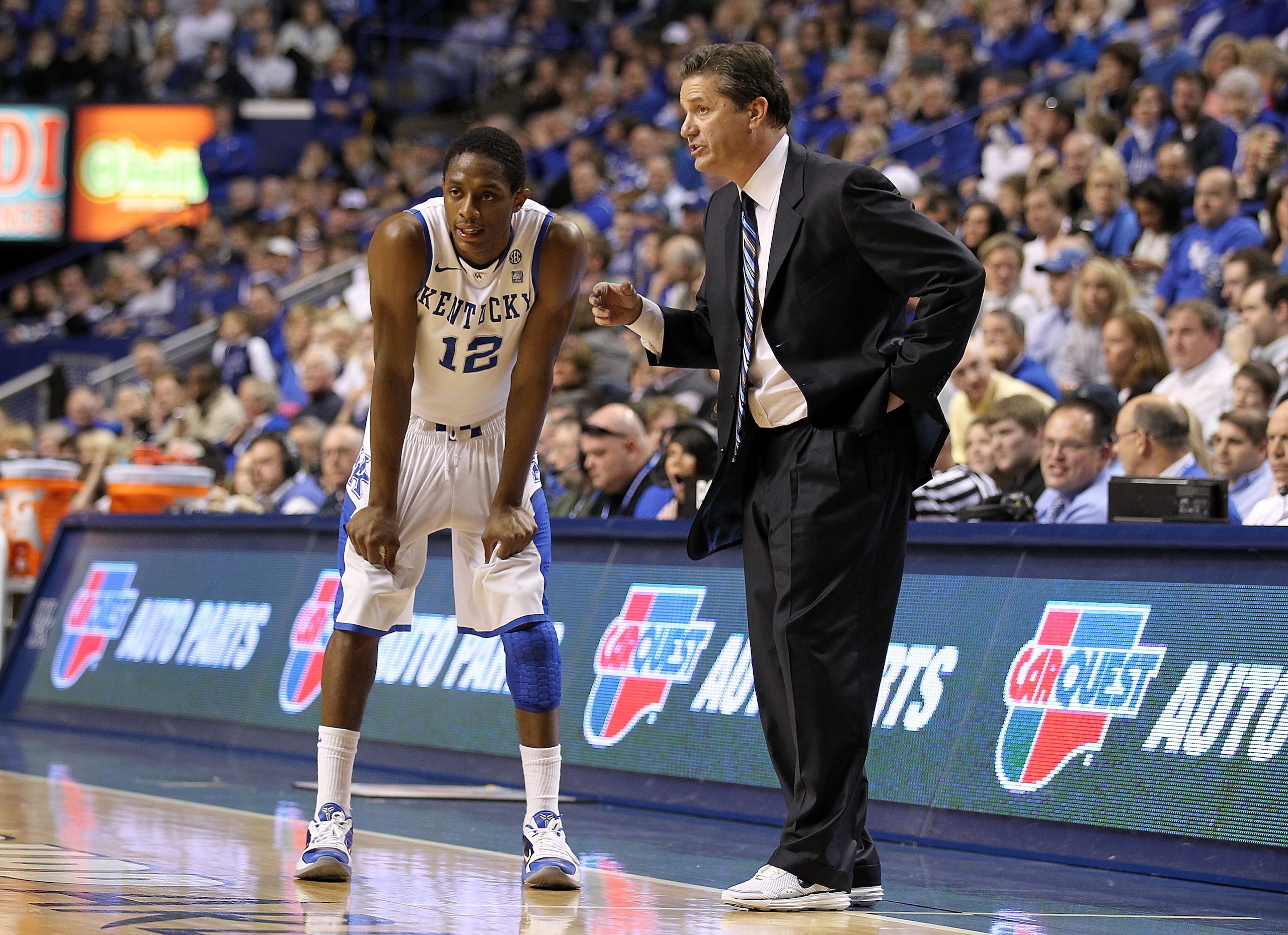 LEXINGTON, KY - JANUARY 29:  John Calipari the Head Coach of the Kentucky Wildcats gives instructions to Brandon Knight #12 during the SEC game against the Georgia Bulldogs at Rupp Arena on January 29, 2011 in Lexington, Kentucky. Kentucky won 66-60.  (Ph