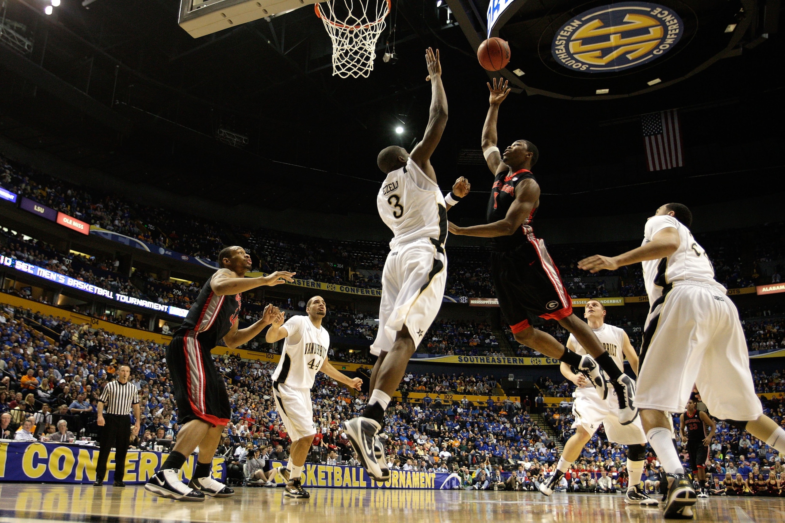 NASHVILLE, TN - MARCH 12:  Travis Leslie #1 of the Georgia Bulldogs drives for a shot attempt against the Vanderbilt Commodores during the quarterfinals of the SEC Men's Basketball Tournament at the Bridgestone Arena on March 12, 2010 in Nashville, Tennes