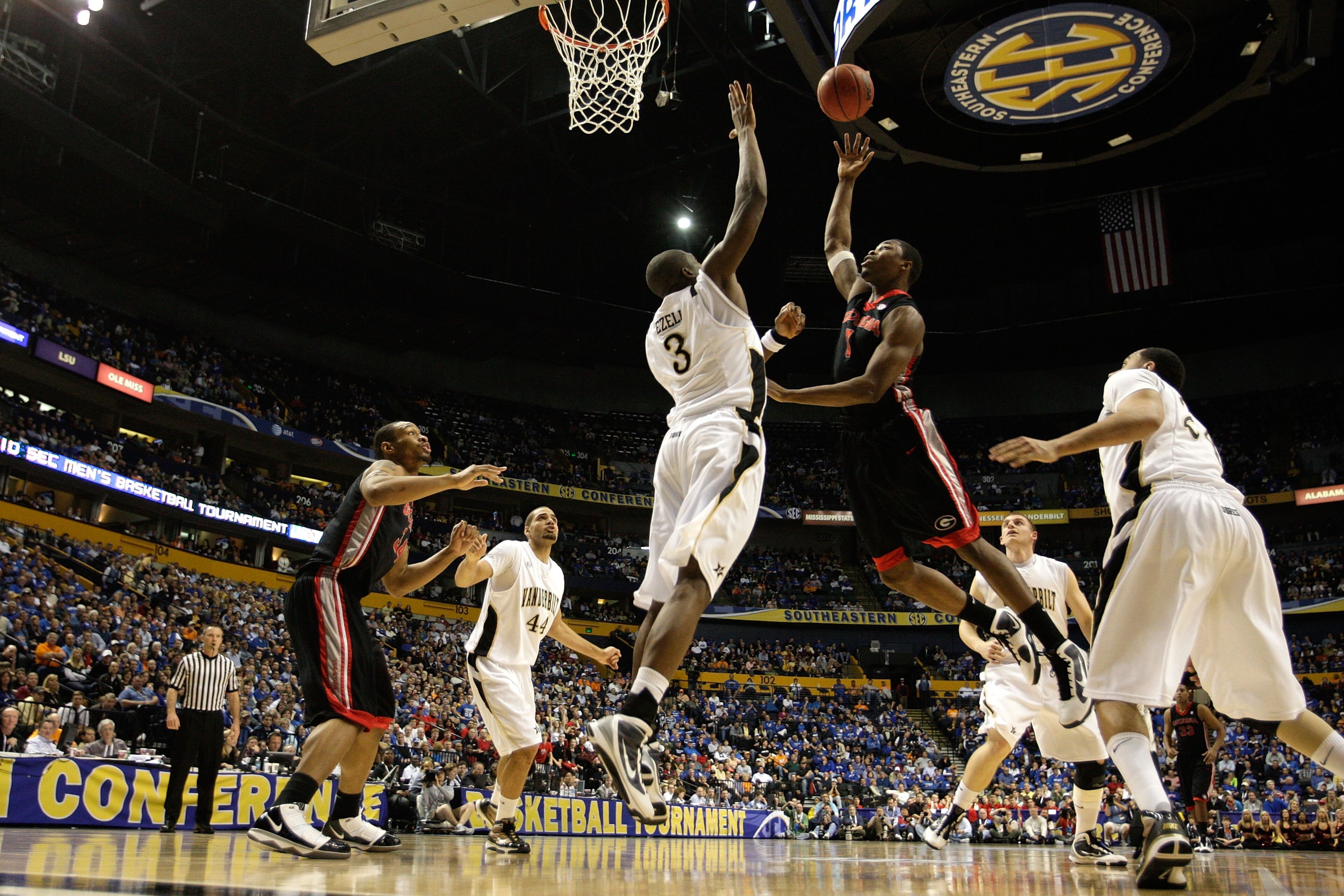 NASHVILLE, TN - MARCH 12: Travis Leslie #1 of the Georgia Bulldogs drives for a shot attempt against the Vanderbilt Commodores during the quarterfinals of the SEC Men's Basketball Tournament at the Bridgestone Arena on March 12, 2010 in Nashville, Tennes NASHVILLE, TN - MARCH 12: Travis Leslie #1 of the Georgia Bulldogs drives for a shot attempt against the Vanderbilt Commodores during the quarterfinals of the SEC Men's Basketball Tournament at the Bridgestone Arena on March 12, 2010 in Nashville, Tennes