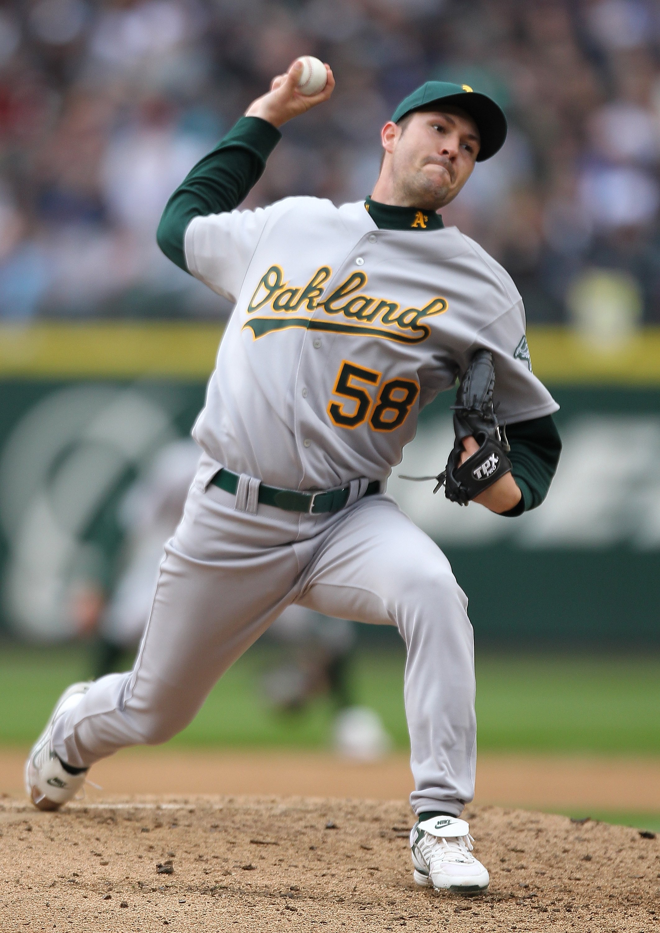 SEATTLE - APRIL 12:  Starting pitcher Justin Duchscherer #58 of the the Oakland Athletics pitches against the Seattle Mariners during the Mariners' home opener at Safeco Field on April 12, 2010 in Seattle, Washington. (Photo by Otto Greule Jr/Getty Images