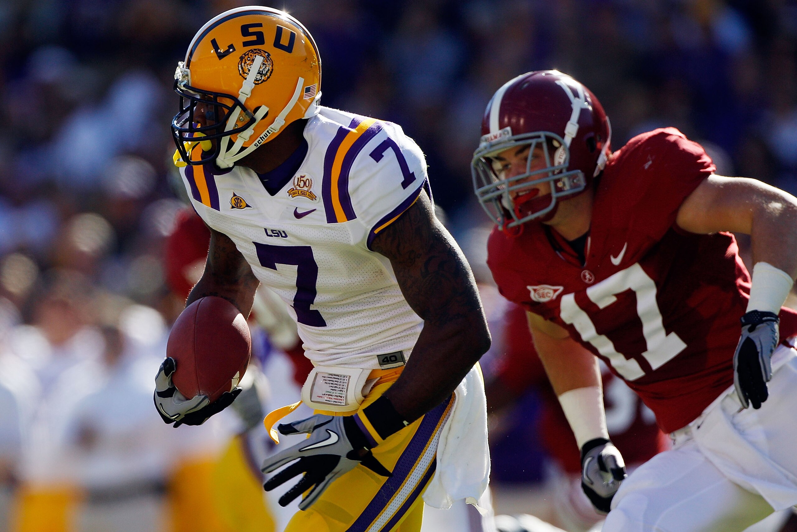 BATON ROUGE, LA - NOVEMBER 06:  Patrick Peterson #7 of the Louisiana State University Tigers avoids a tackle by Brad Smelley #17 of the Alabama Crimson Tide  at Tiger Stadium on November 6, 2010 in Baton Rouge, Louisiana.  (Photo by Chris Graythen/Getty I